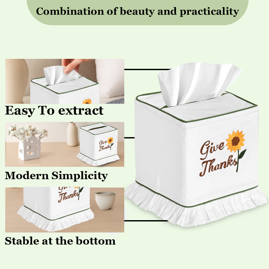 Tissue box cover with 'Give Thanks' text and sunflower design, shown with a hand extracting tissues.