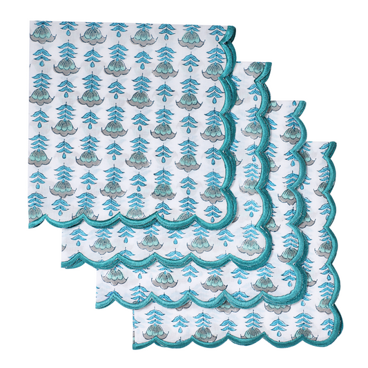 Set of three decorative napkins with a blue and green pattern on a white background