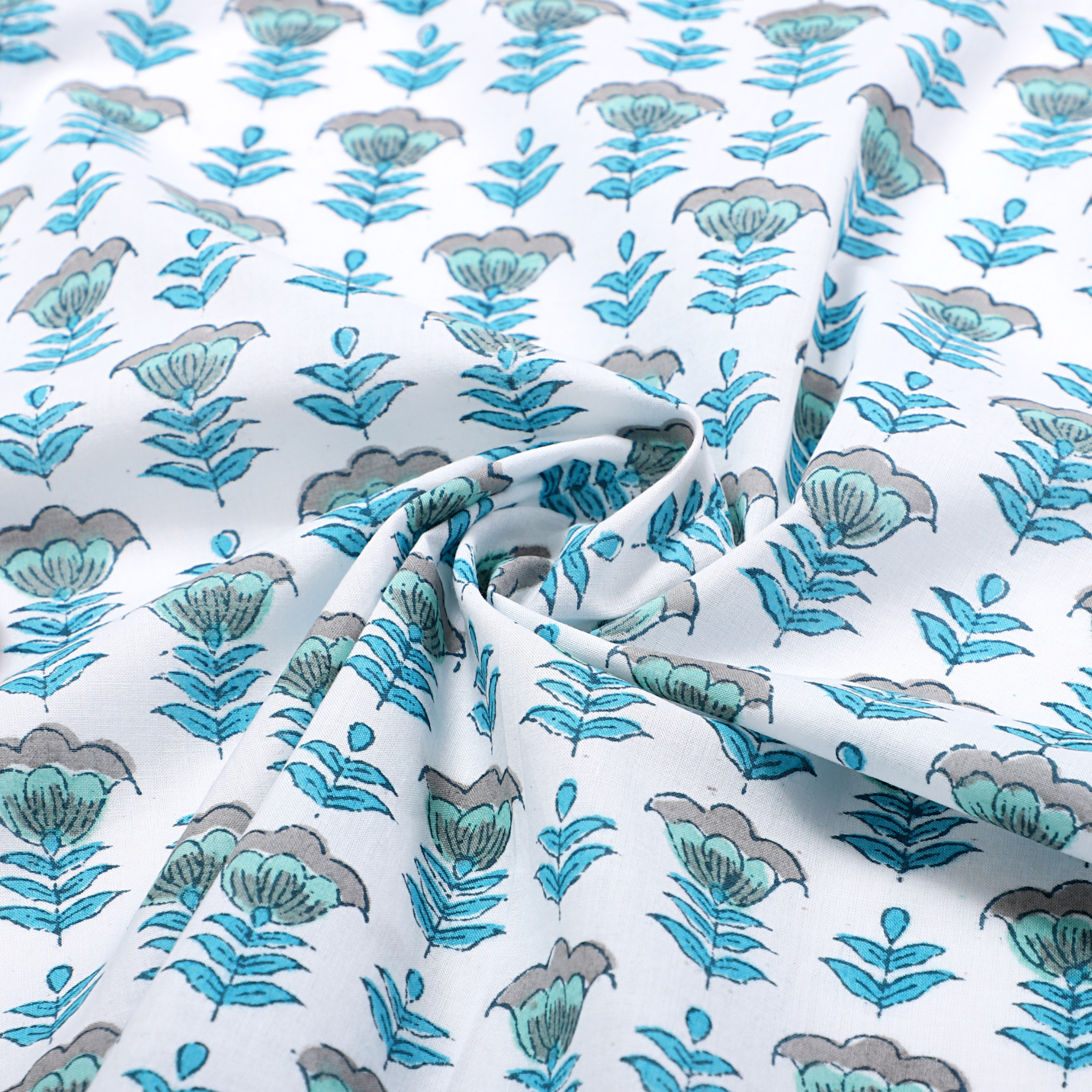 Floral patterned fabric with blue and green flowers on a white background