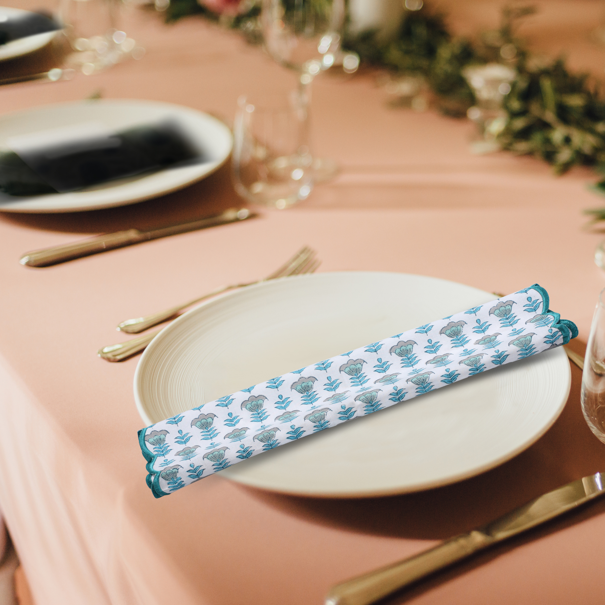 Decorative napkin with floral pattern on a table setting