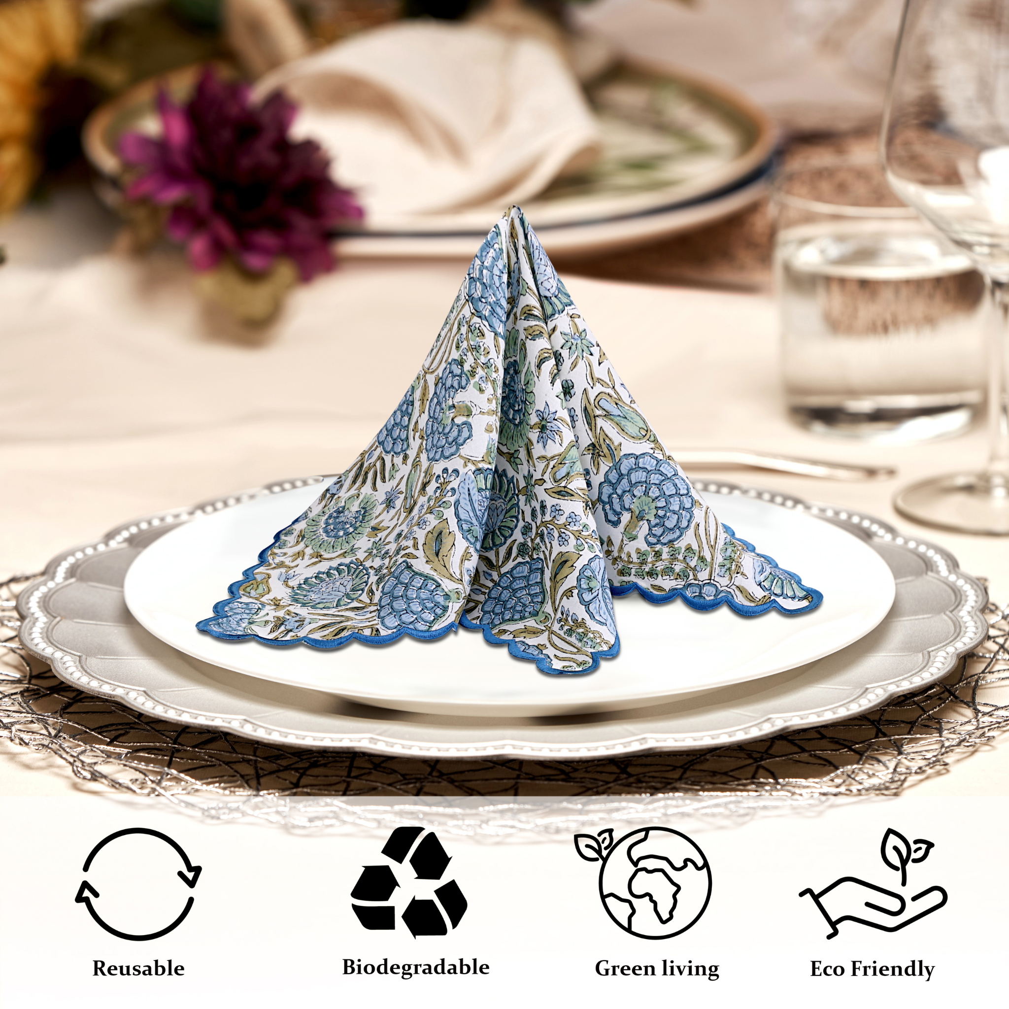 Decorative folded napkin on a plate with table setting and eco-friendly icons.