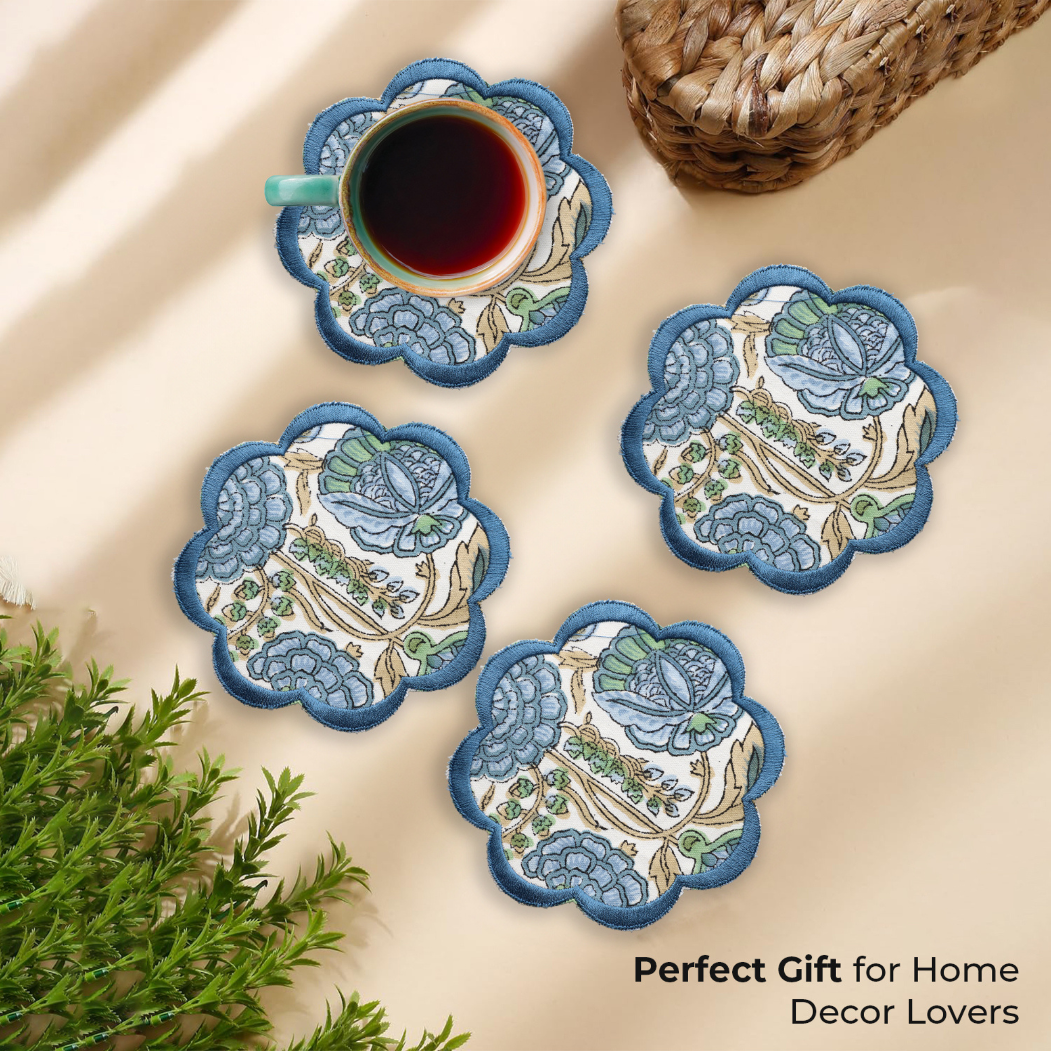 Set of decorative coasters with floral patterns on a beige surface with a cup of coffee.