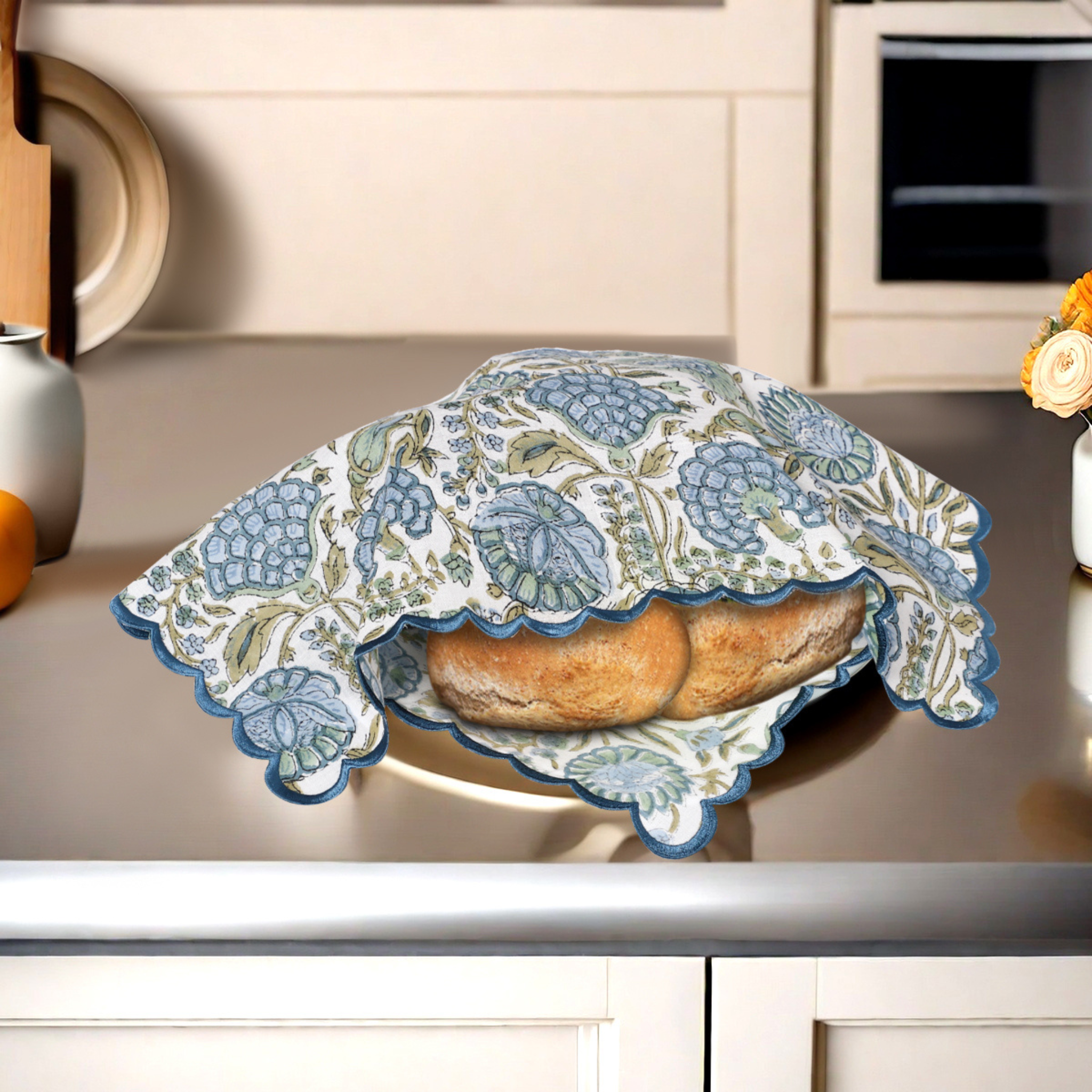 Bread in a decorative cloth on a kitchen counter
