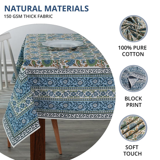 Tablecloth with blue and green patterns on a table, featuring text about natural materials and fabric details.