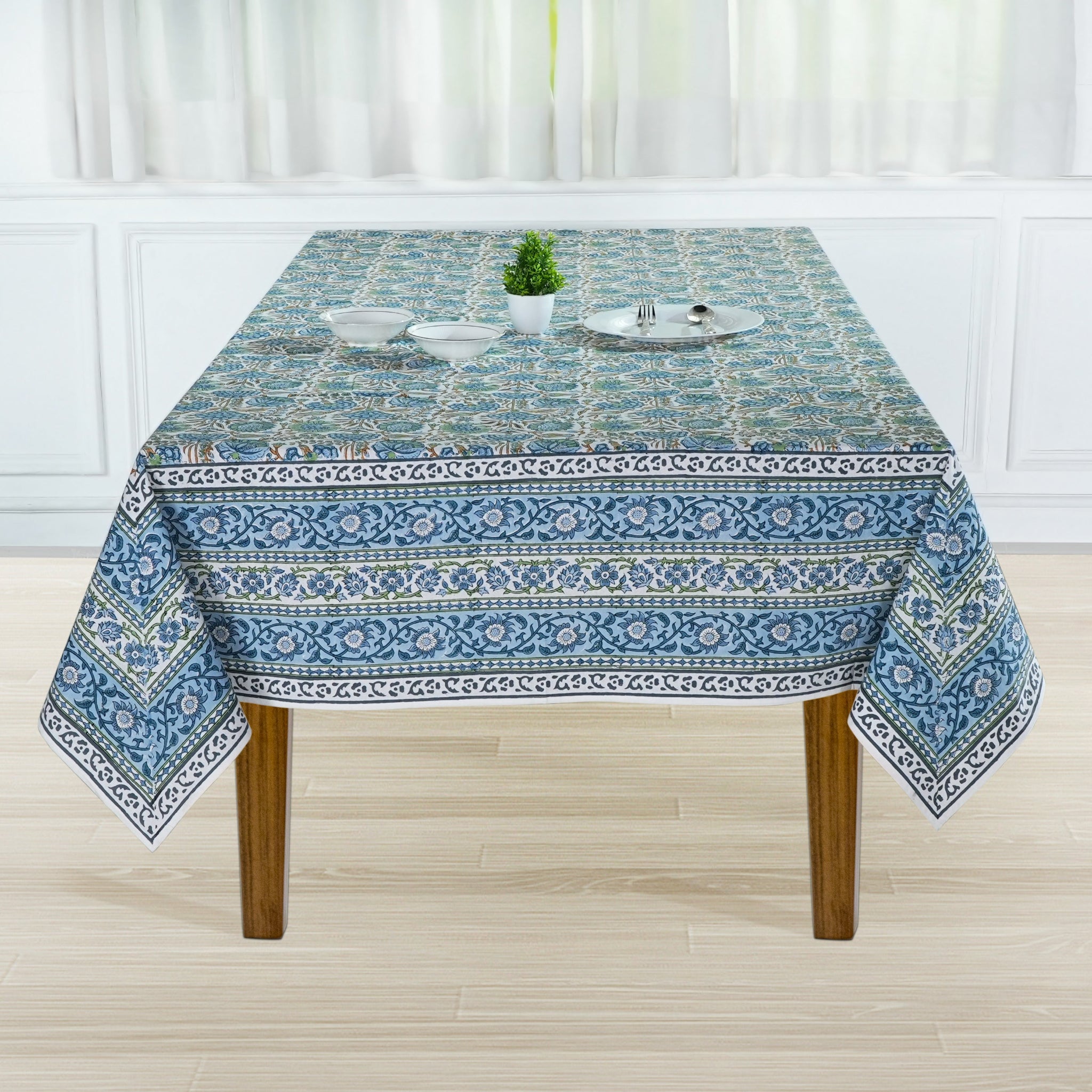 Tablecloth with blue and white pattern on a wooden table