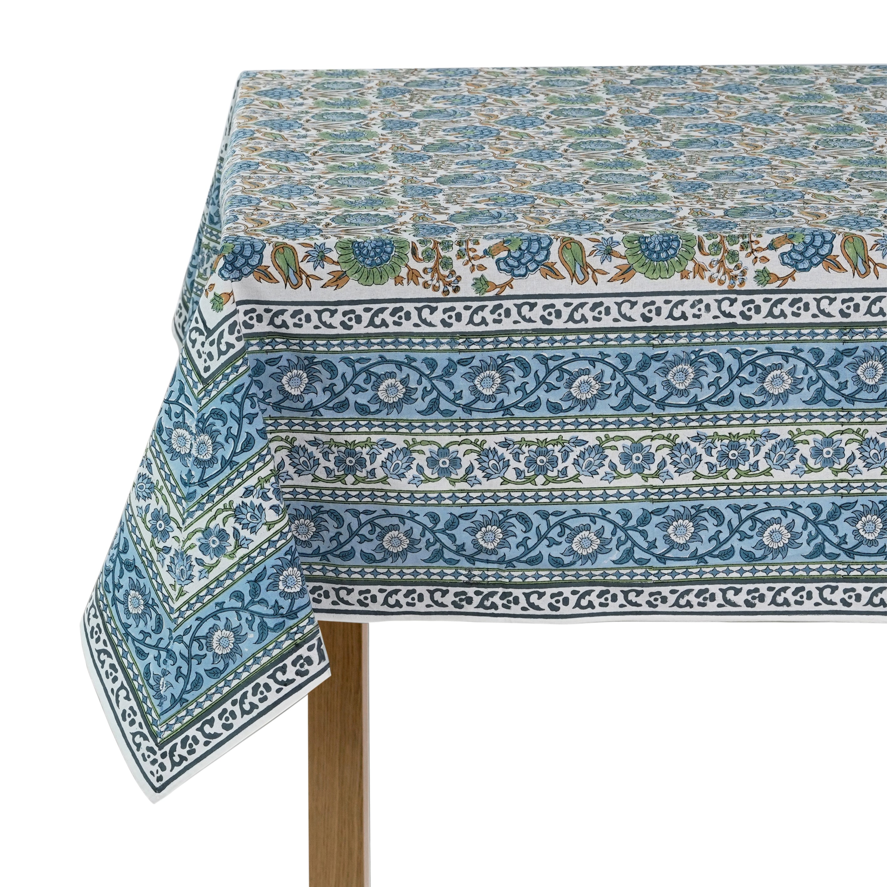 Decorative tablecloth with blue and white pattern on a white background