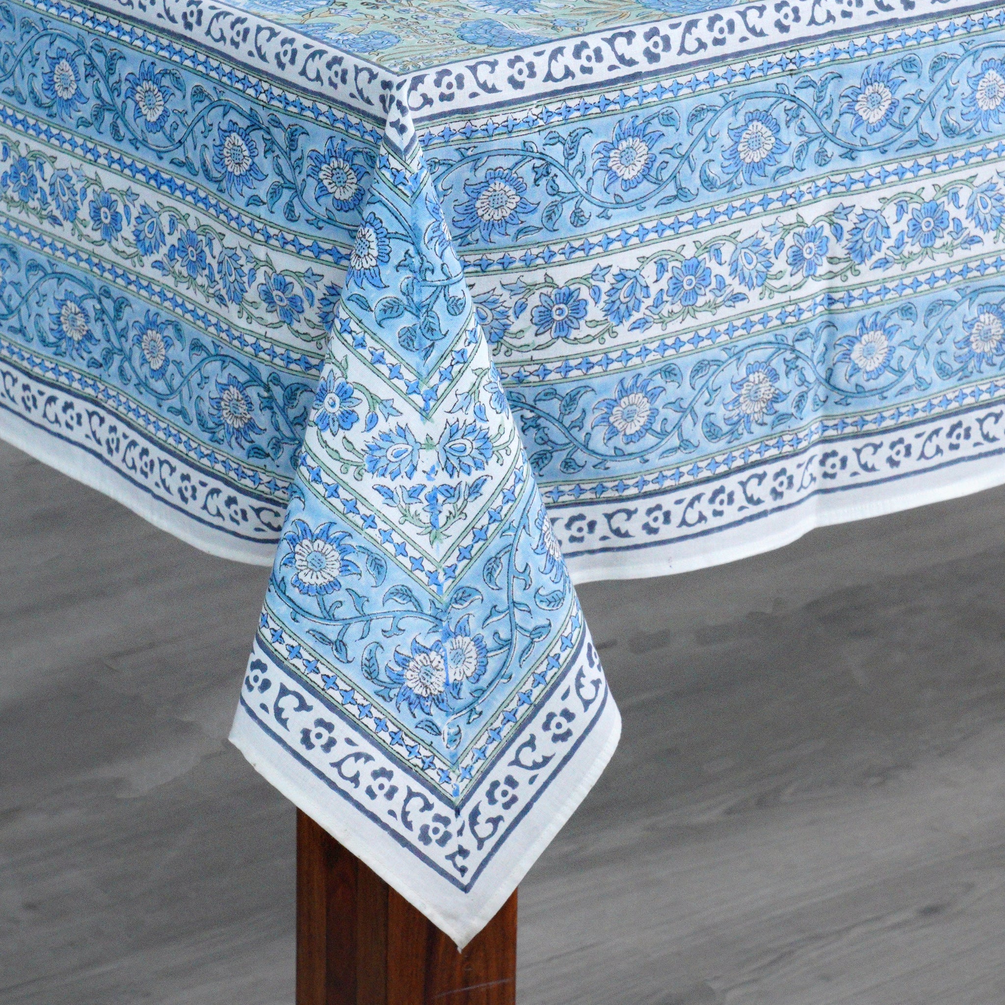 Blue patterned tablecloth on a wooden table