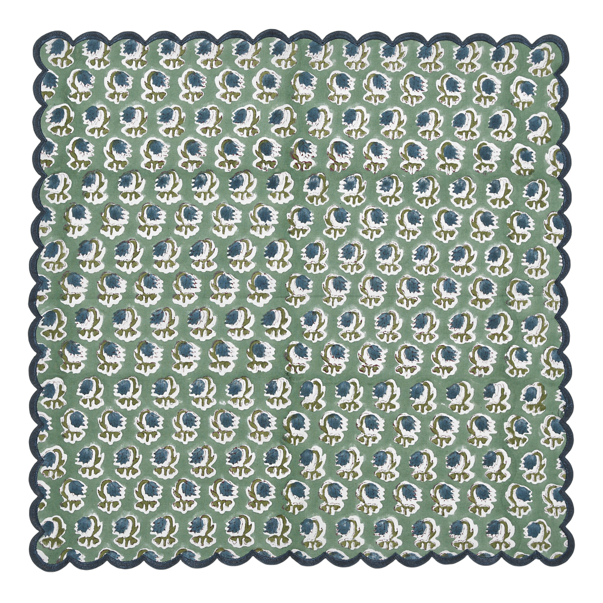 Patterned fabric with blue and white design on a green background