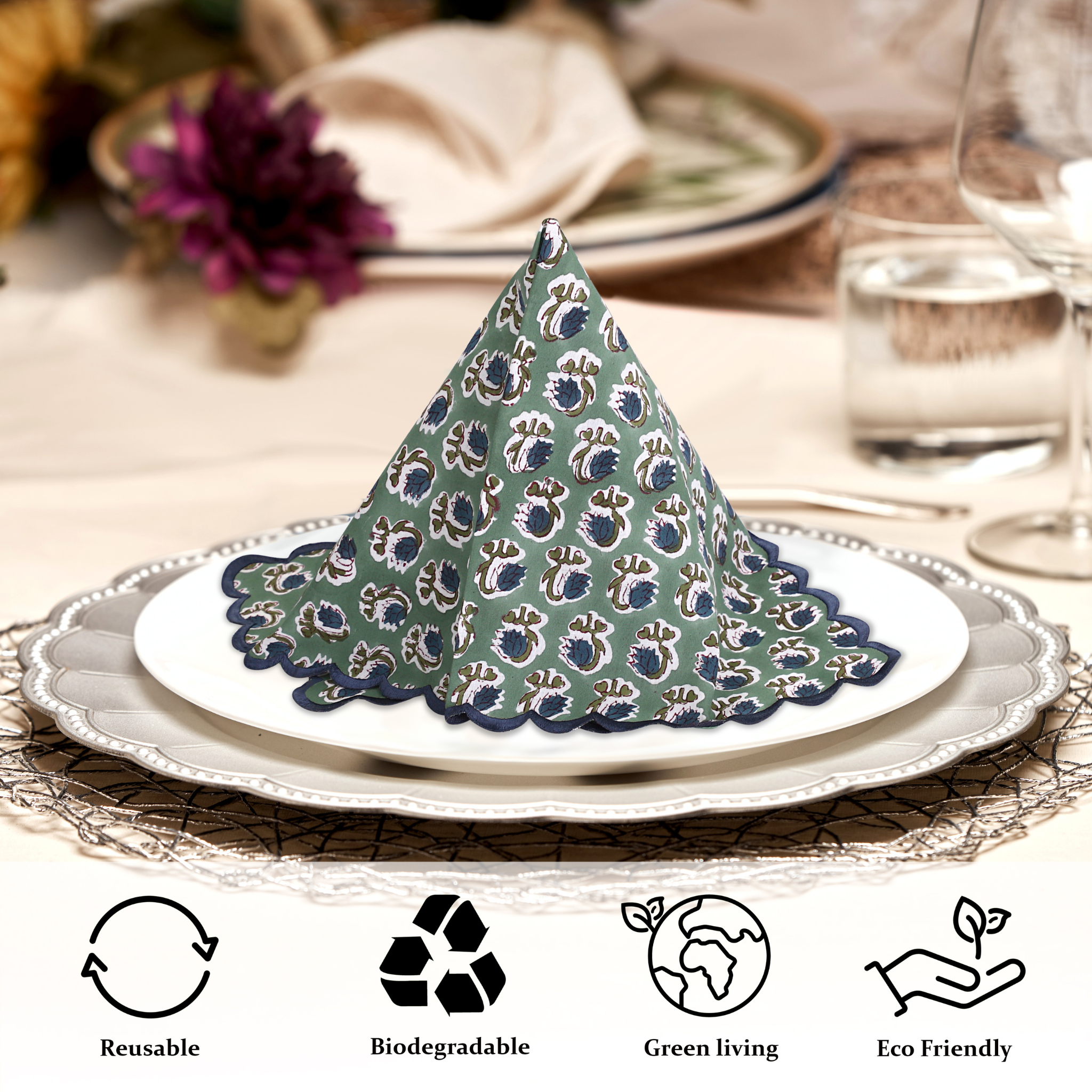 Decorative cone-shaped napkin on a plate with table setting and product icons indicating sustainability.
