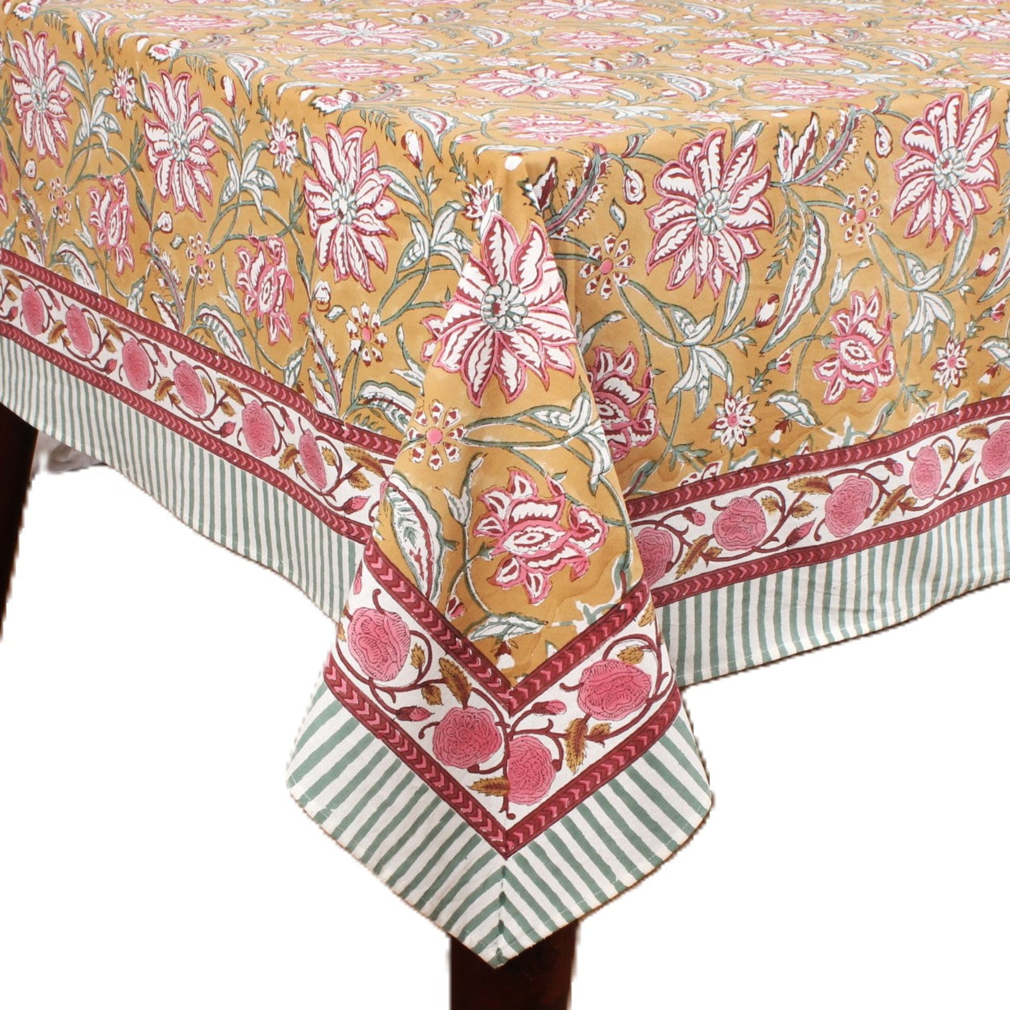 Floral patterned tablecloth with pink flowers and green stripes on a white background