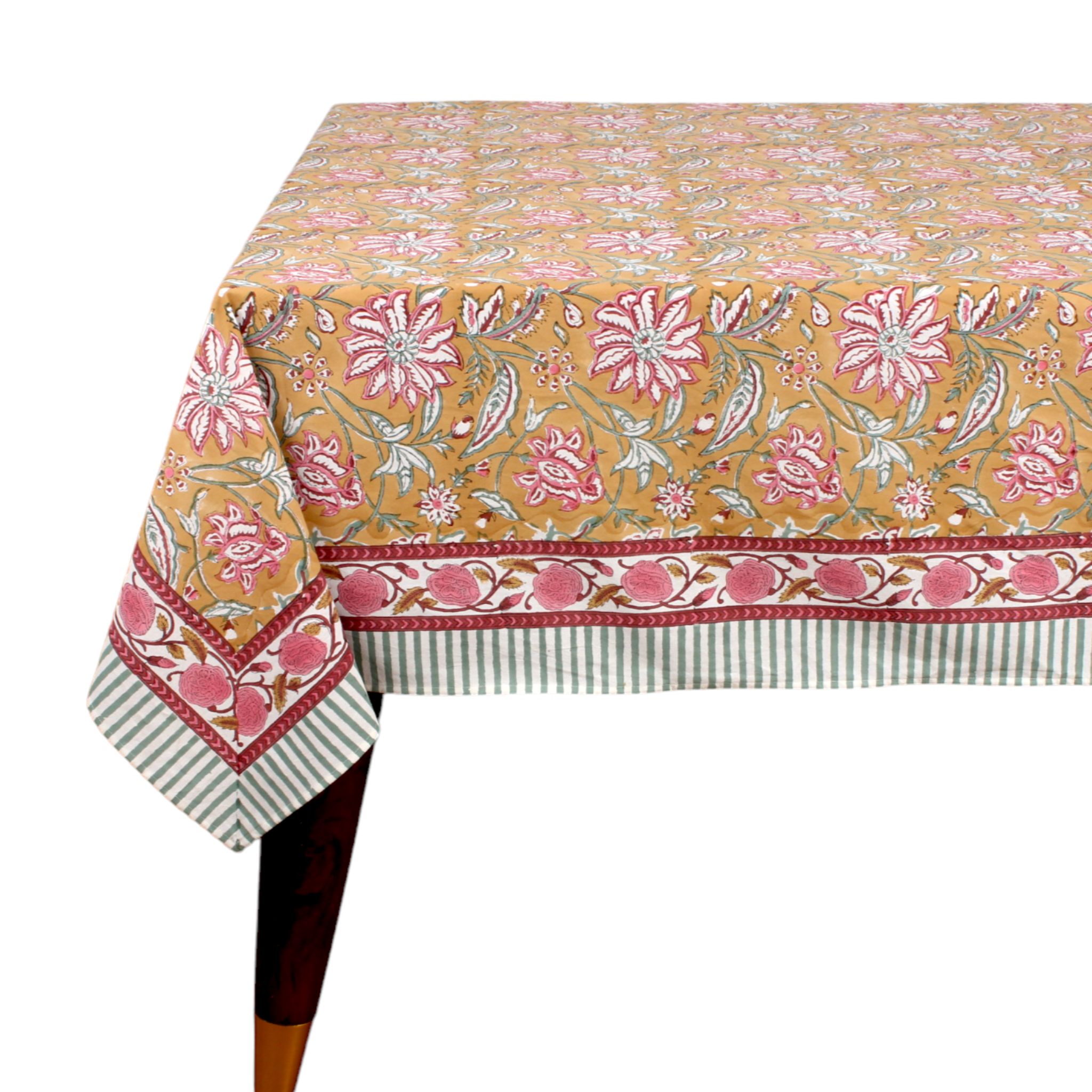 Floral patterned tablecloth on a table with a white background
