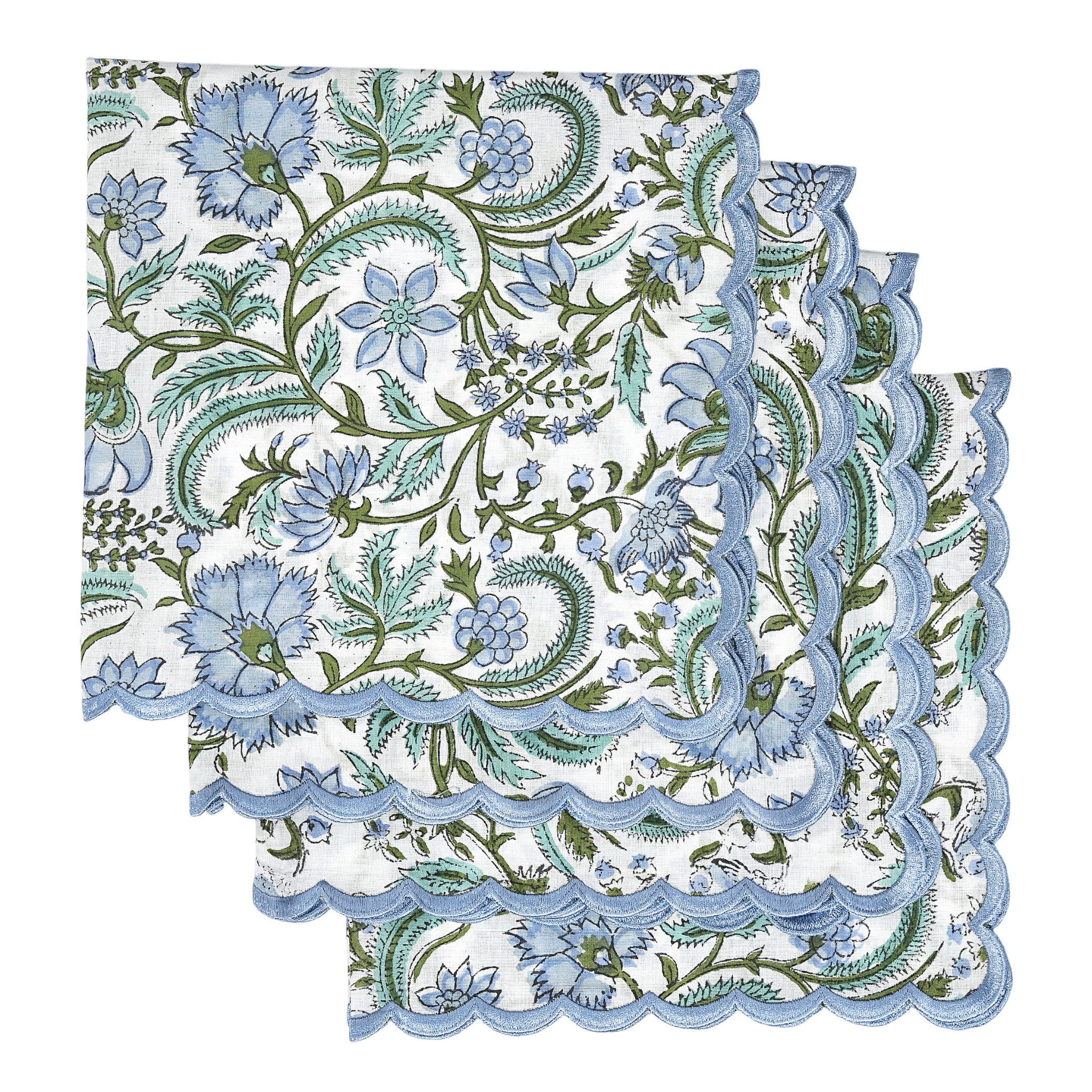 Decorative napkin with floral pattern and scalloped edge on a white background