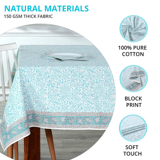 Tablecloth with floral pattern on a table, featuring text about natural materials and fabric properties.
