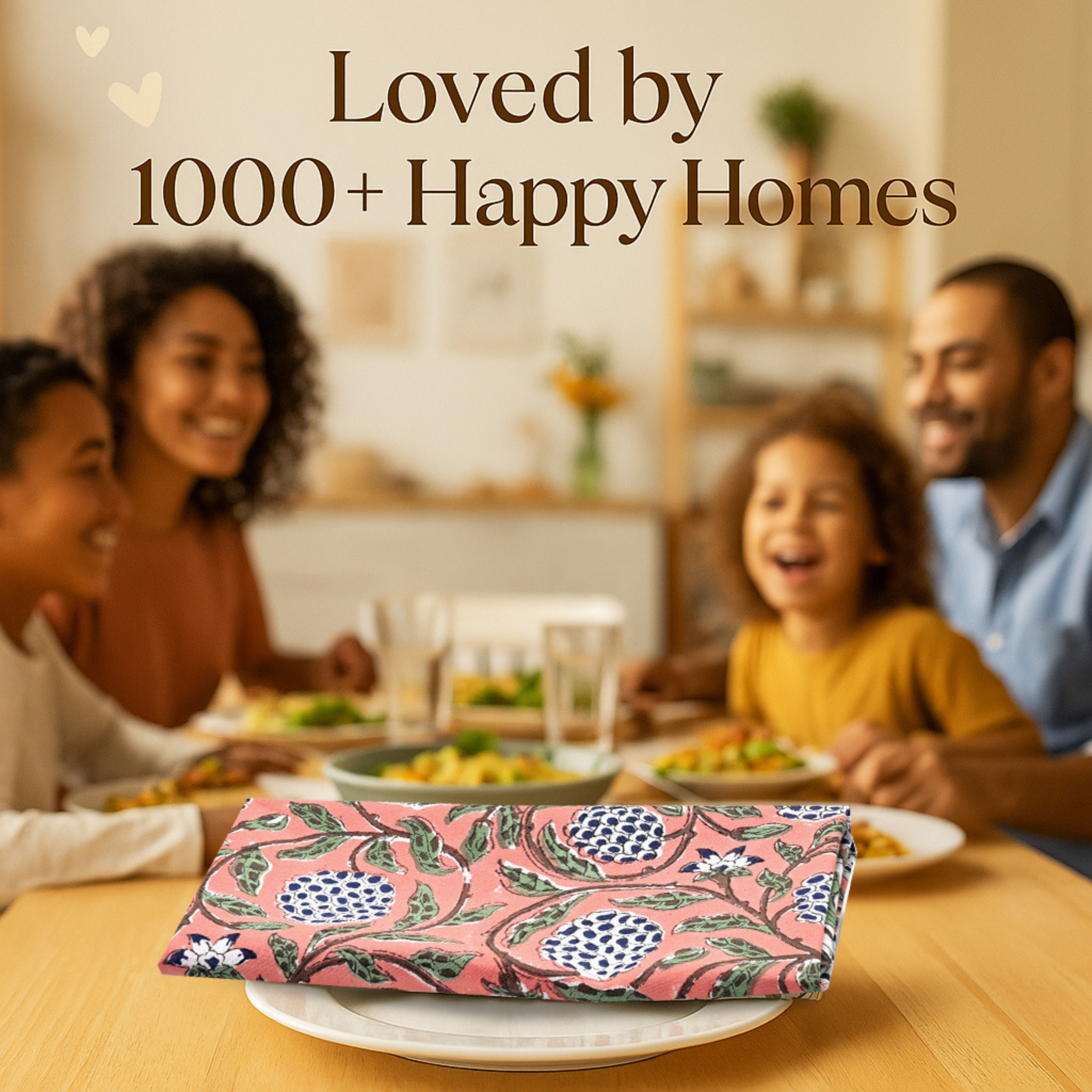 Family sitting around a dinner table with a pink floral napkin in the foreground.