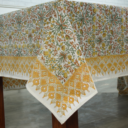 Decorative tablecloth with floral pattern on a wooden table