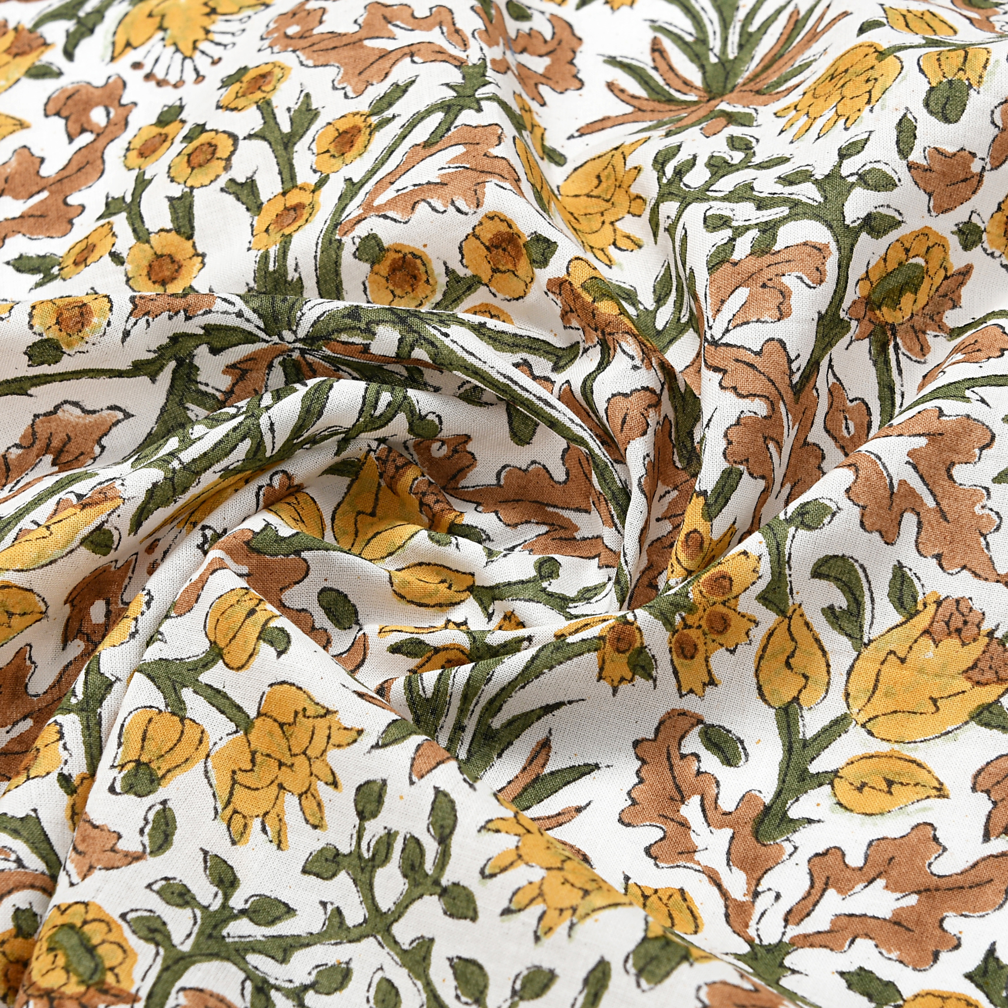 Floral fabric pattern with yellow, orange, and green flowers on a white background