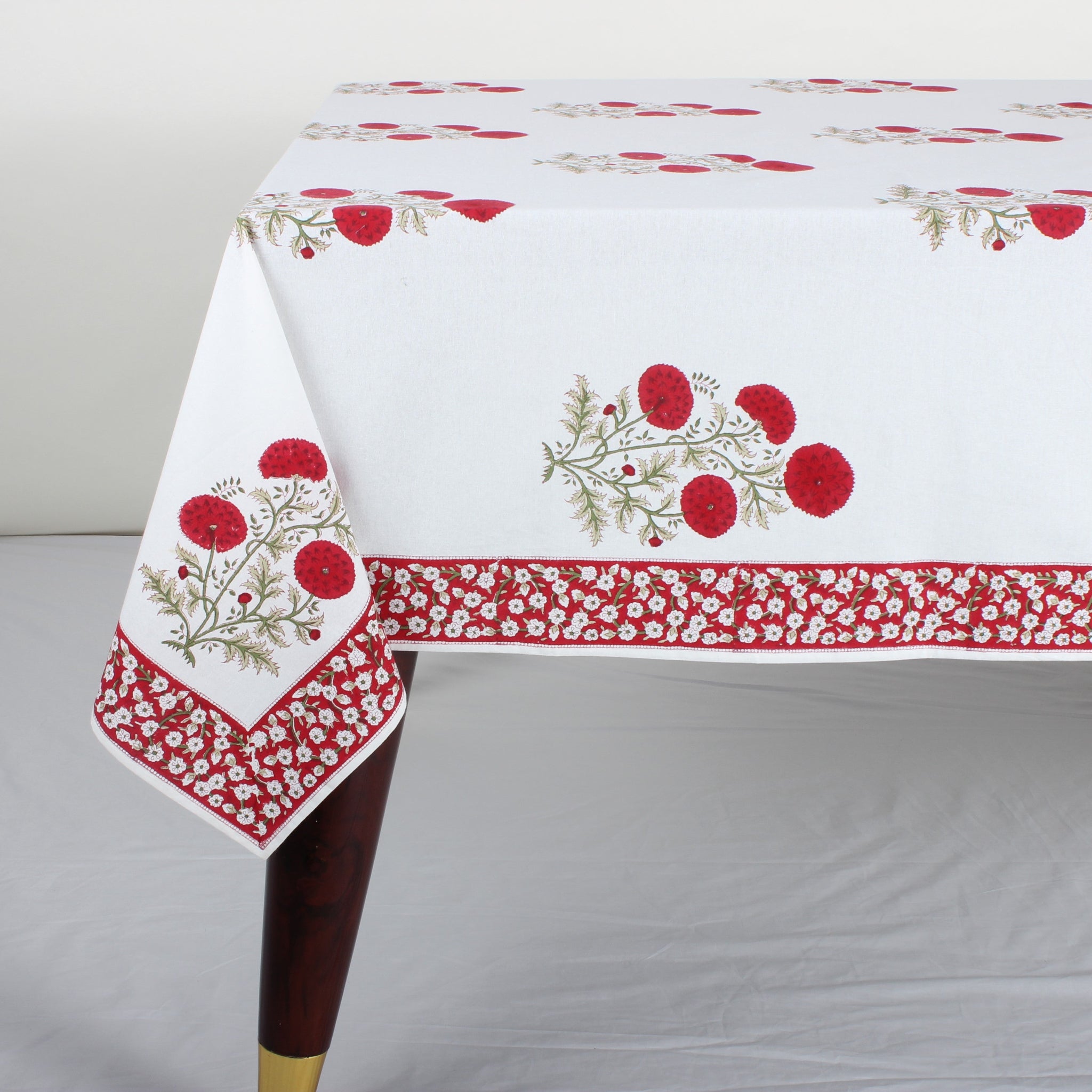 Tablecloth with red floral pattern on a white background