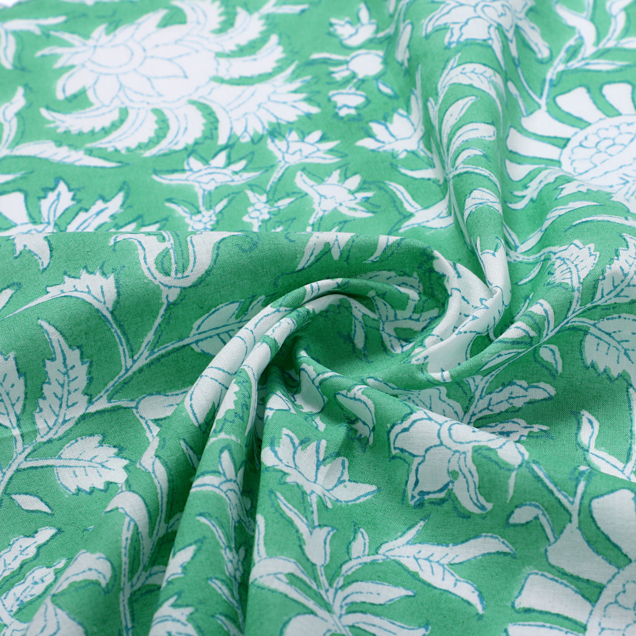 Green fabric with white floral pattern