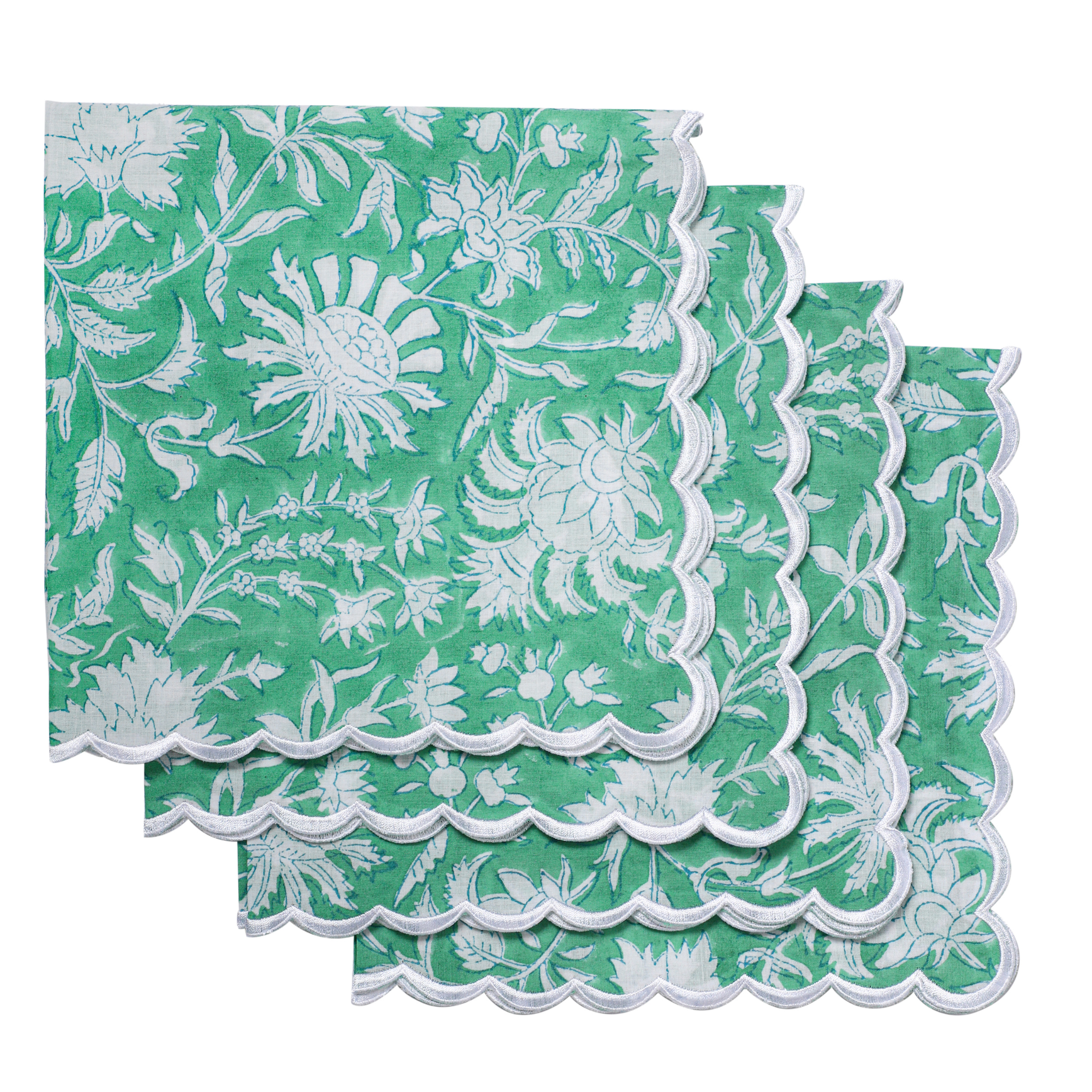 Green and white floral patterned napkins on a white background