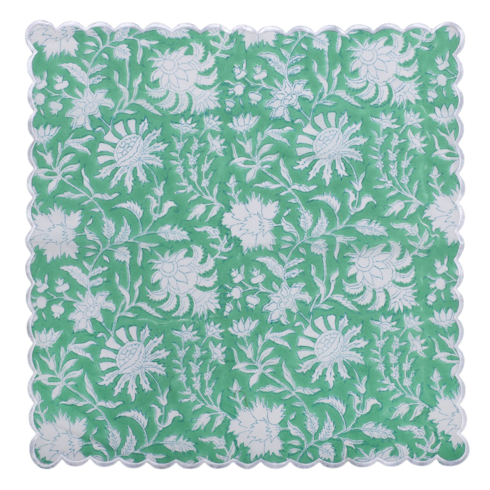 Floral patterned fabric swatch with white flowers on a green background