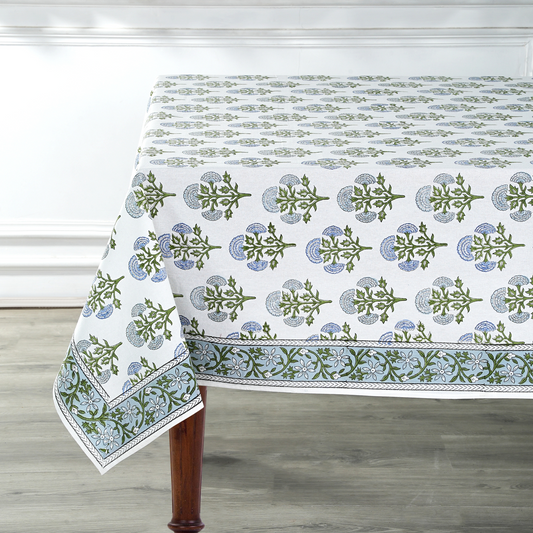 Tablecloth with green floral pattern on a wooden table