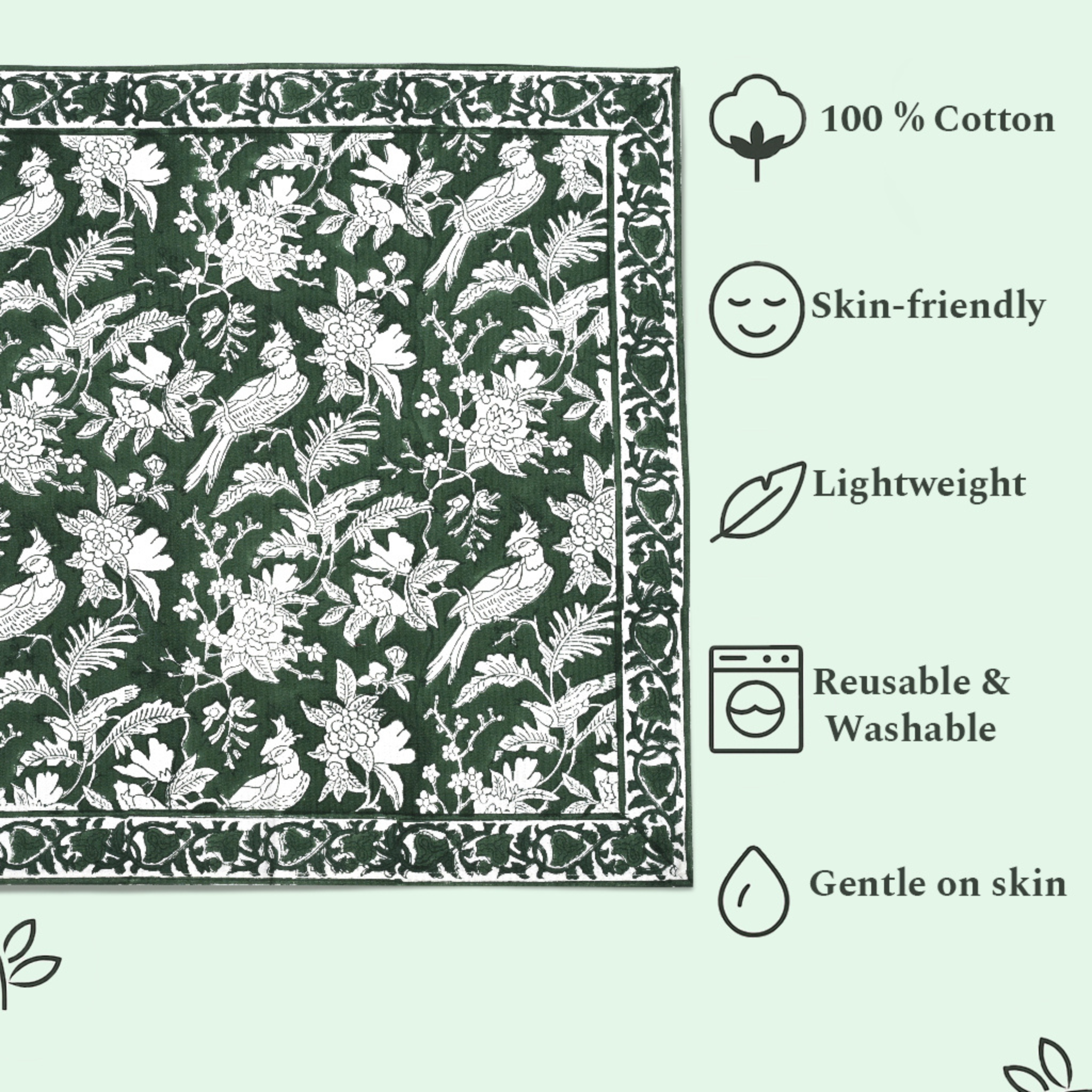Green fabric with white floral and bird pattern, featuring icons and text about fabric properties.