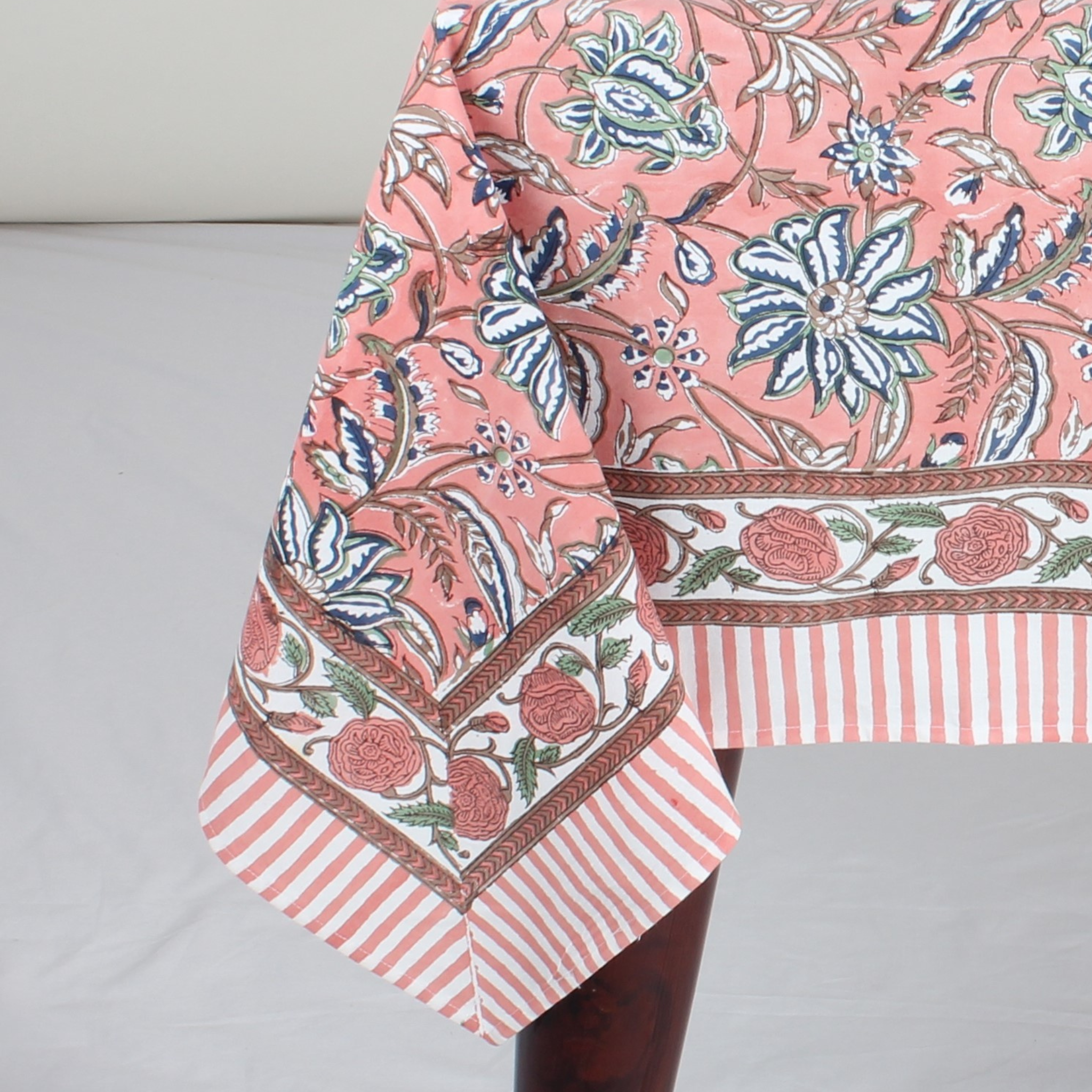 Floral and striped fabric on a gray background