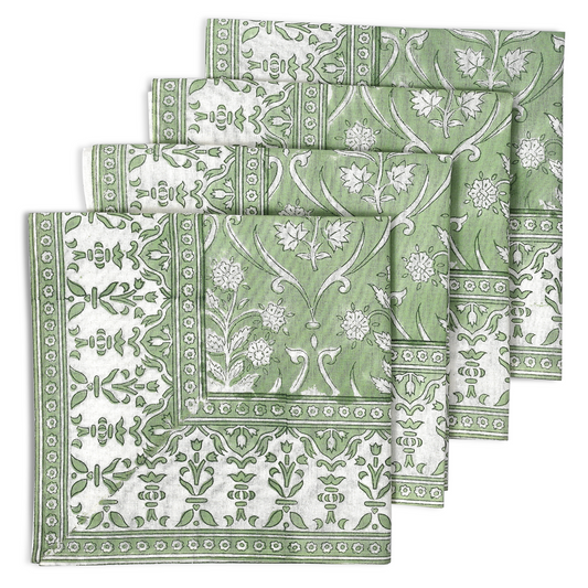 Set of green and white patterned napkins on a white background