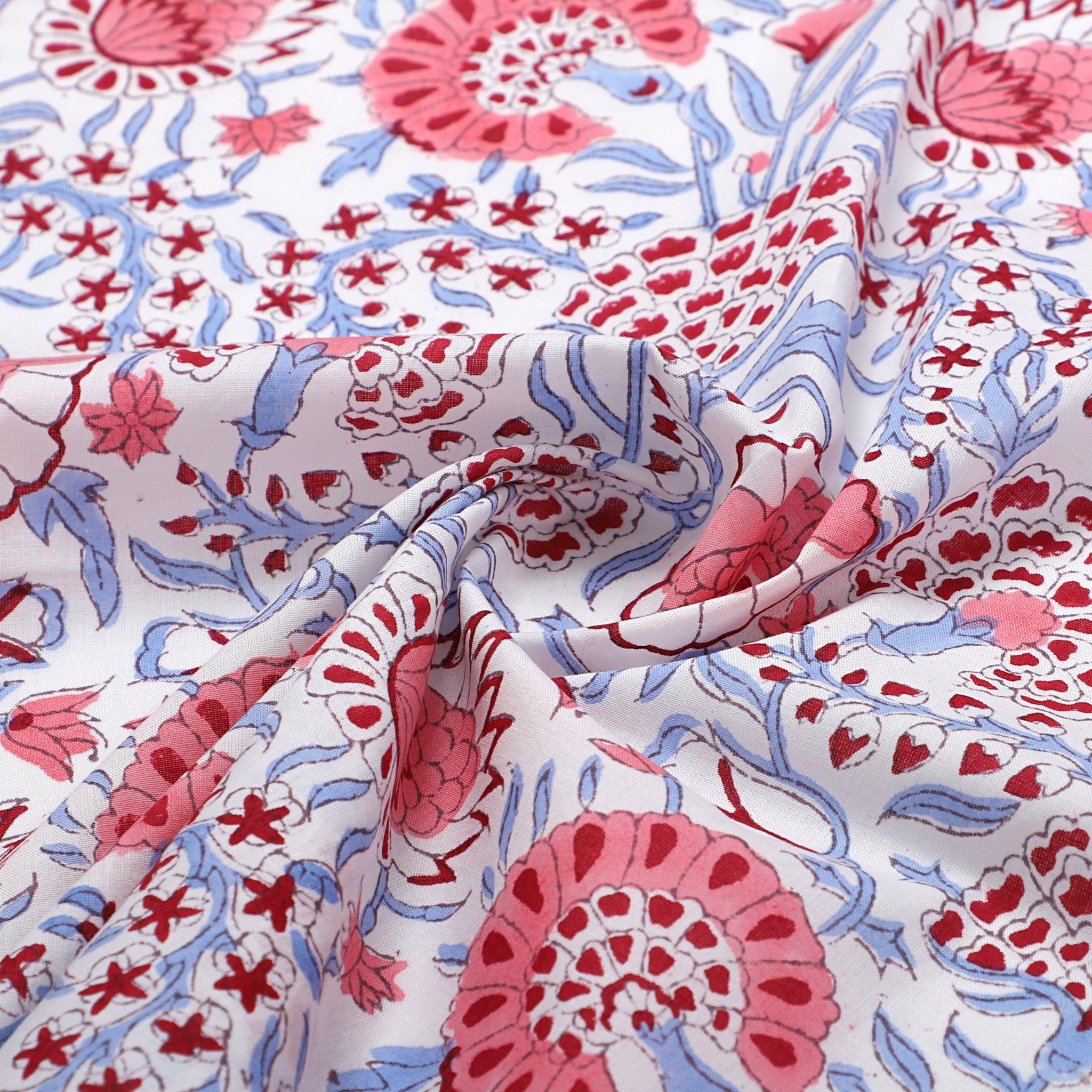 Floral patterned fabric with pink, red, and blue colors on a white background