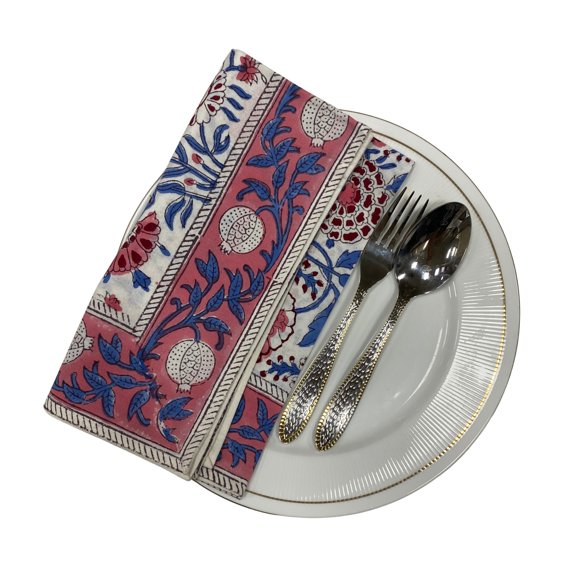 Decorative napkin with floral pattern on a white plate with silver cutlery