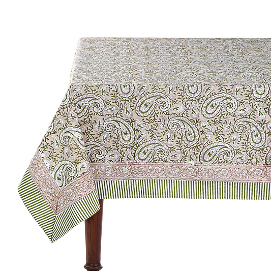 Patterned tablecloth on a wooden table with a white background