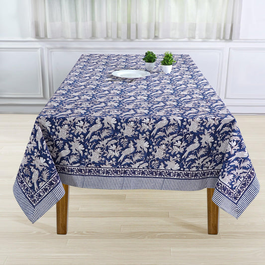 Tablecloth with blue and white floral pattern on a wooden table.