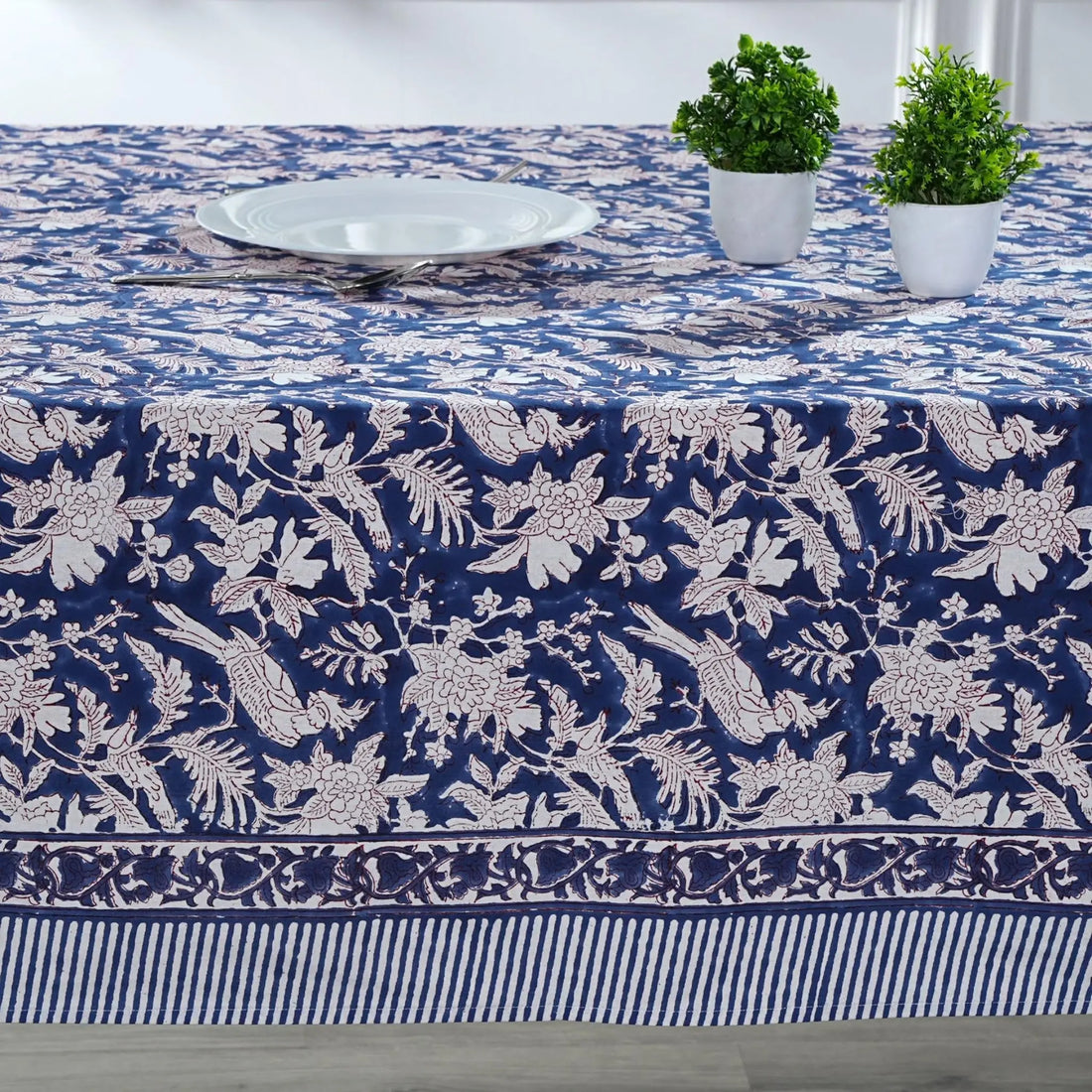 Tablecloth with blue and white floral pattern on a dining table.