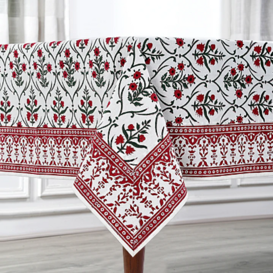 Decorative tablecloth with red and black floral patterns on a white background