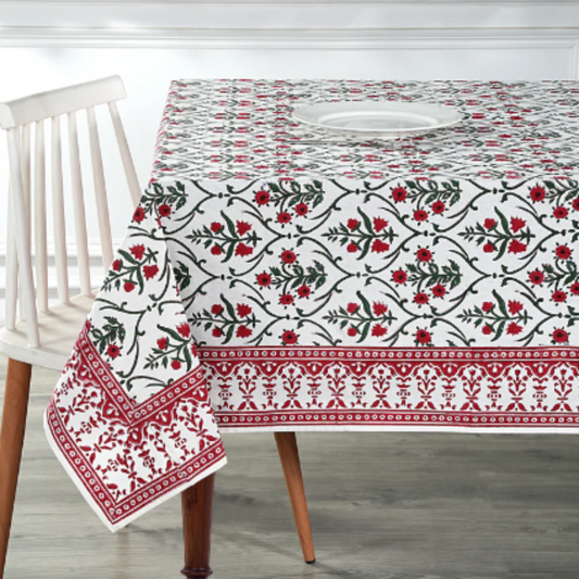 Decorative tablecloth with floral pattern on a wooden table