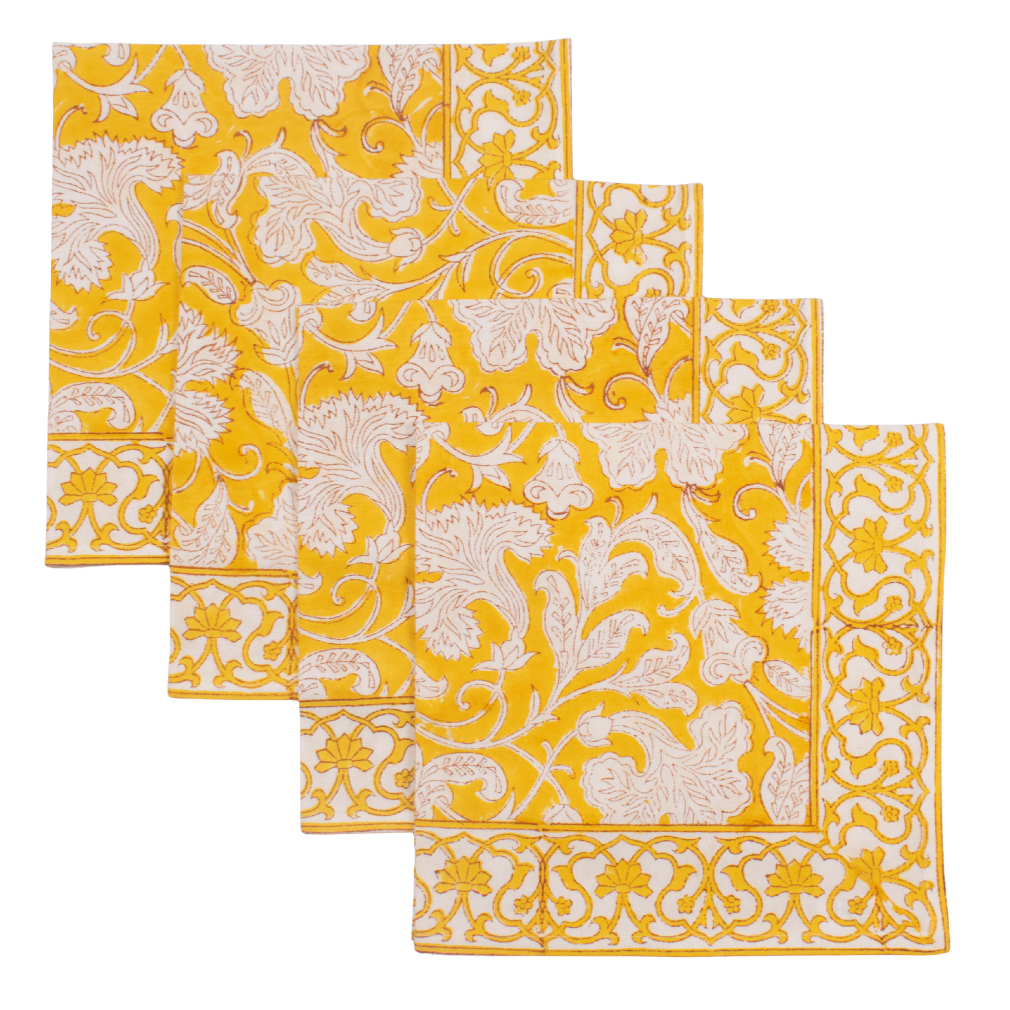 Set of four yellow and white patterned placemats on a white background