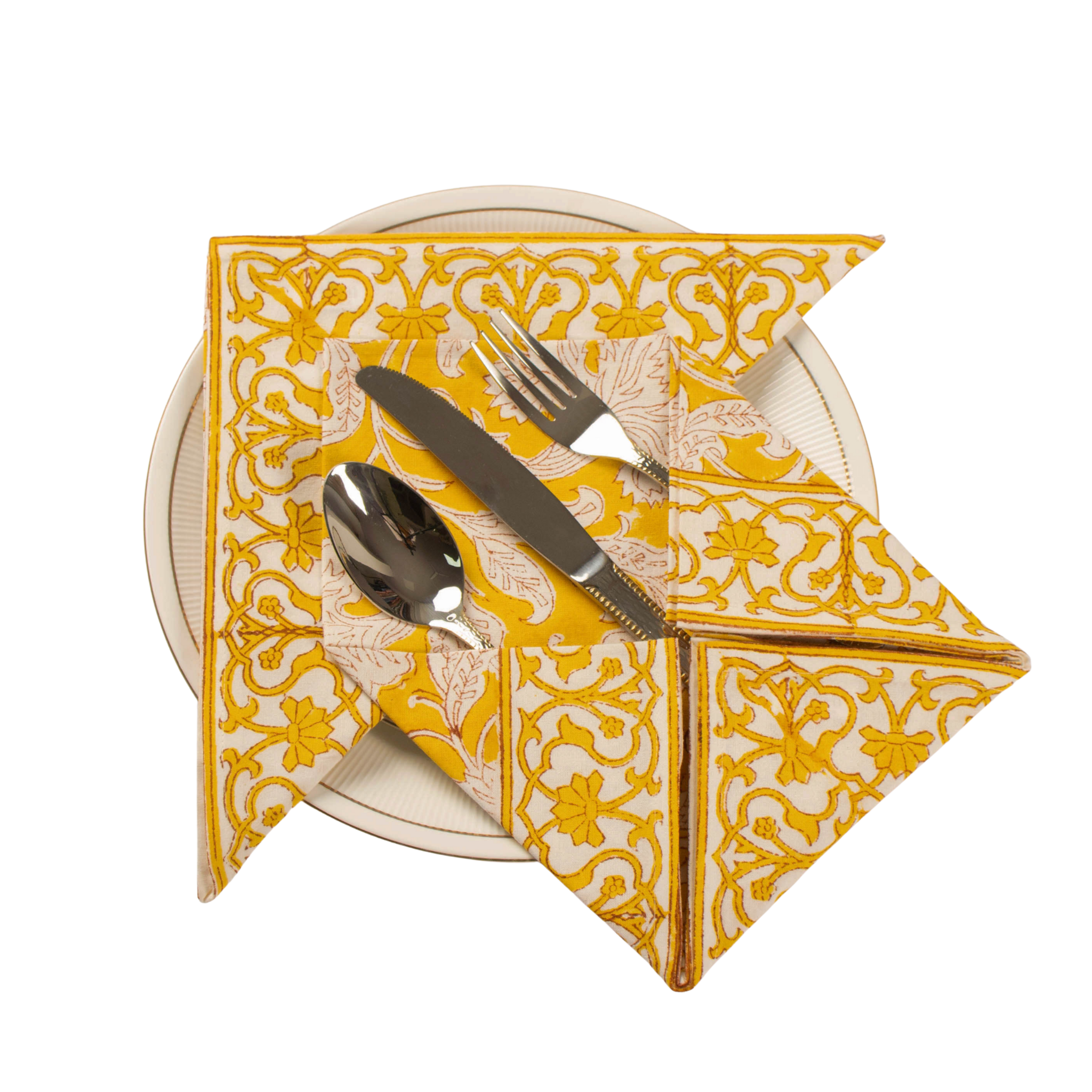 Folded patterned napkin with silverware on a white background