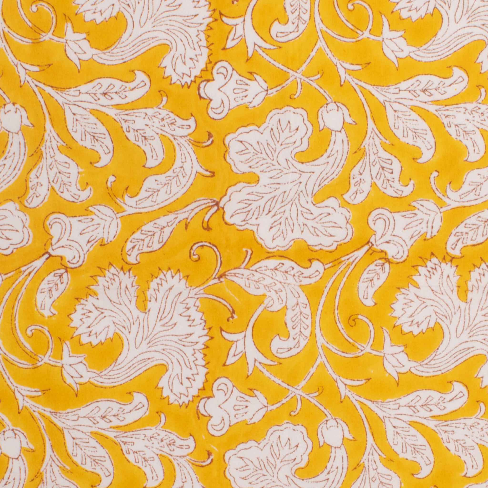 Patterned fabric with white floral design on a yellow background