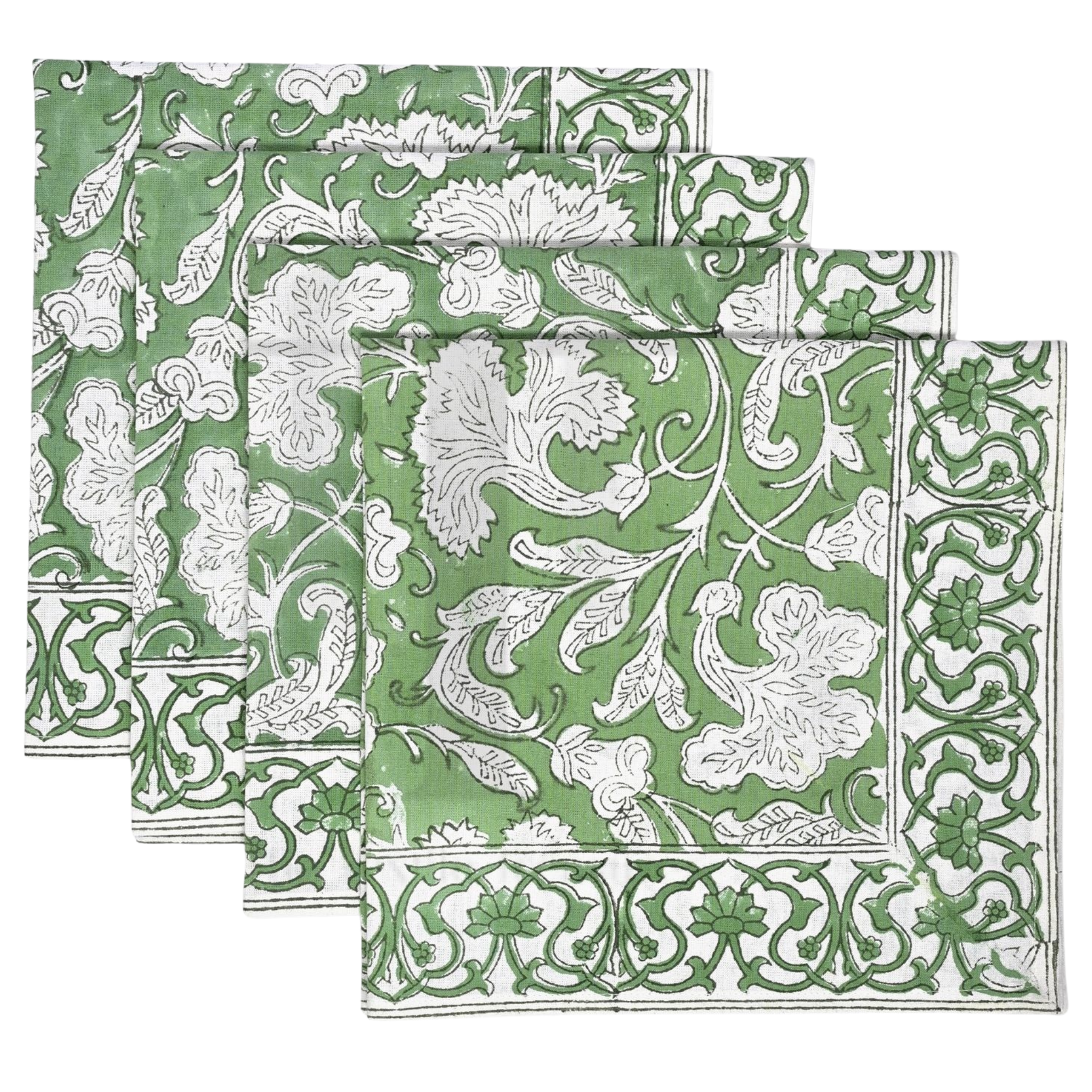 Set of green and white patterned napkins on a white background