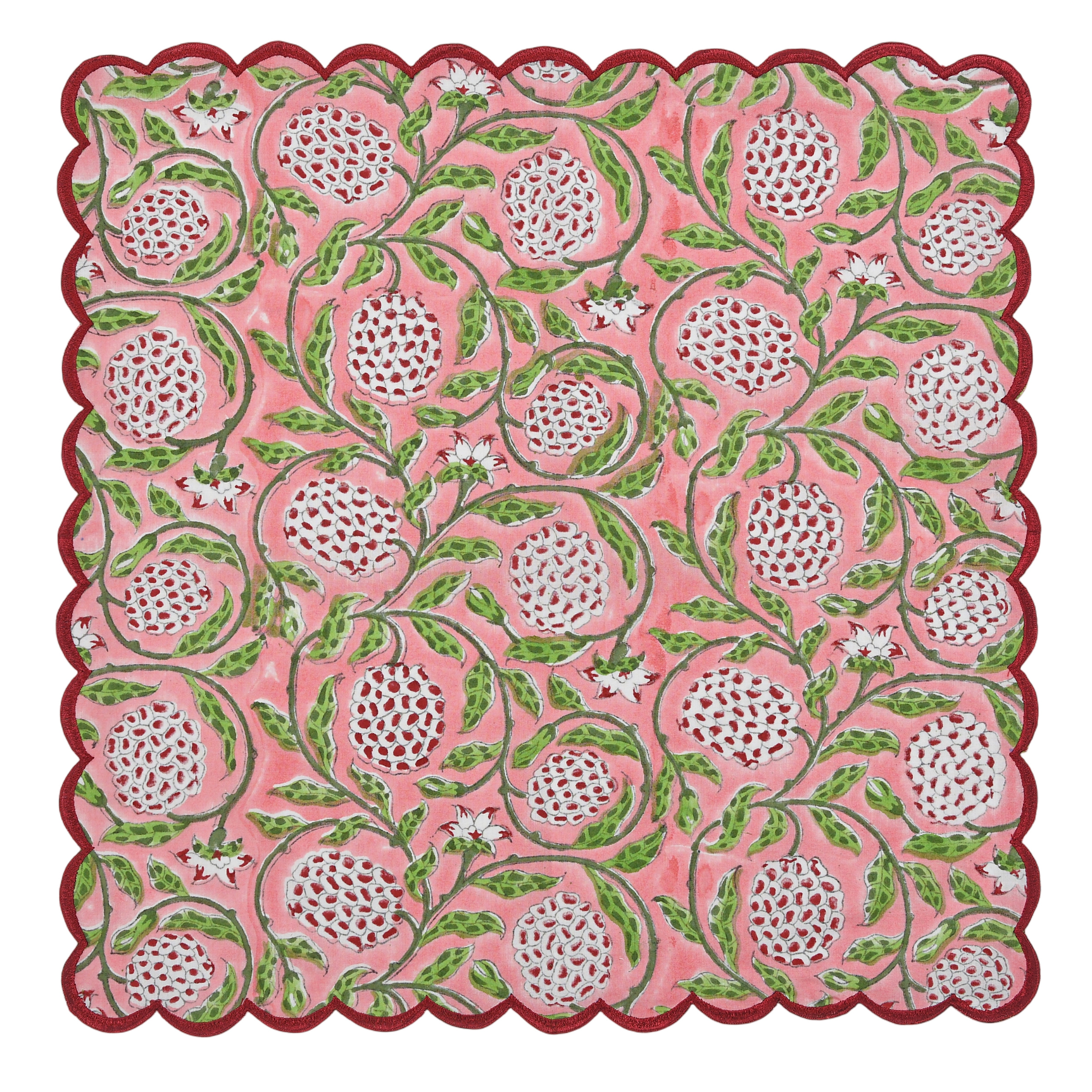 Decorative pink mat with white floral patterns and green leaves on a white background