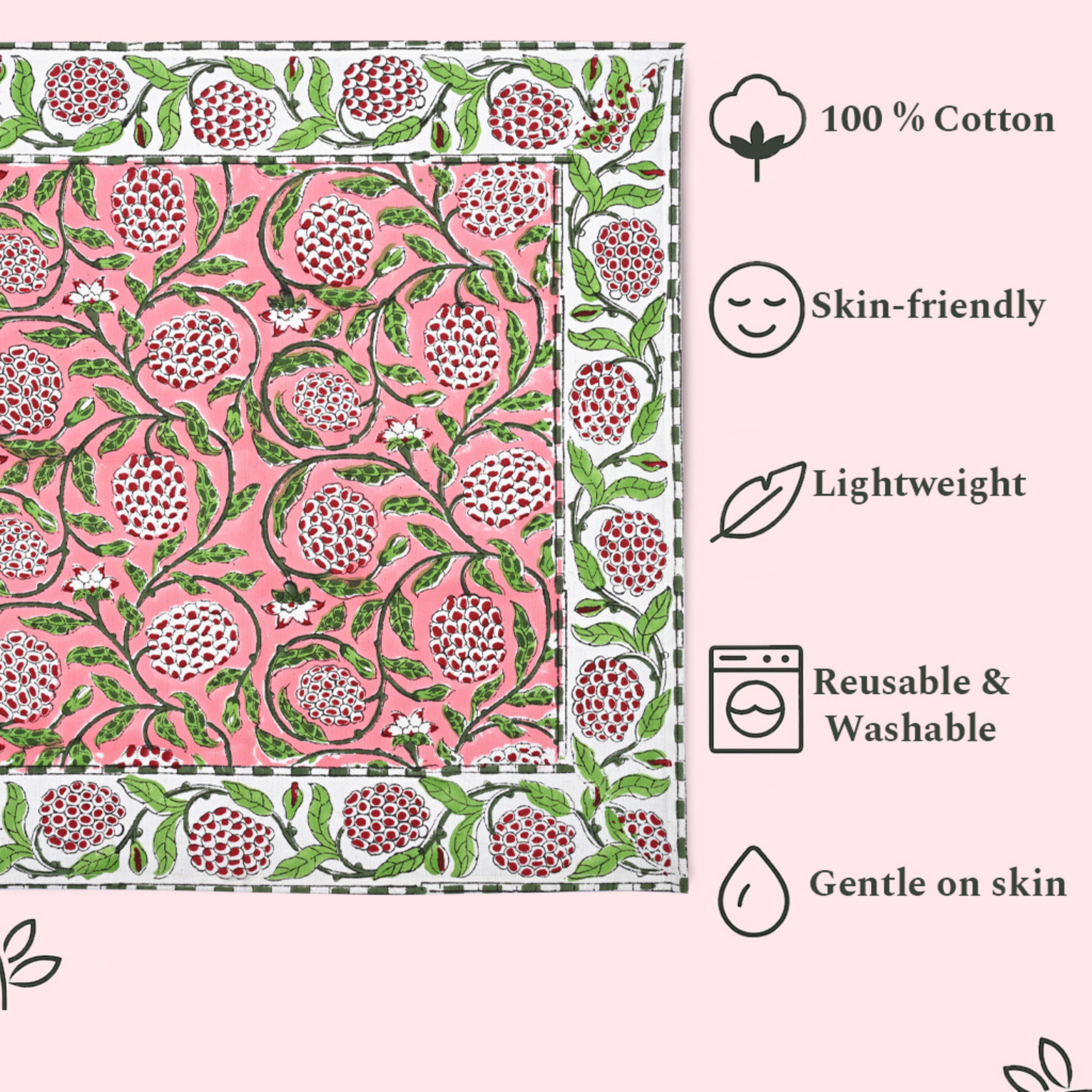 Pink fabric with green floral pattern and text highlighting features on a white background