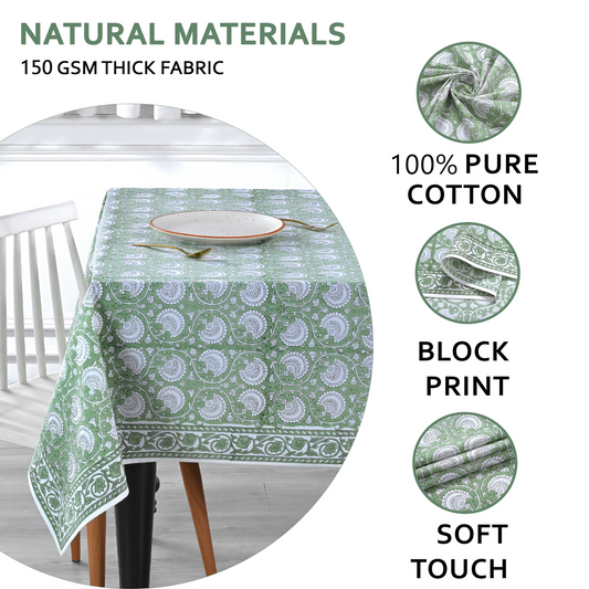 Green patterned tablecloth on a table with text highlighting natural materials and fabric details.