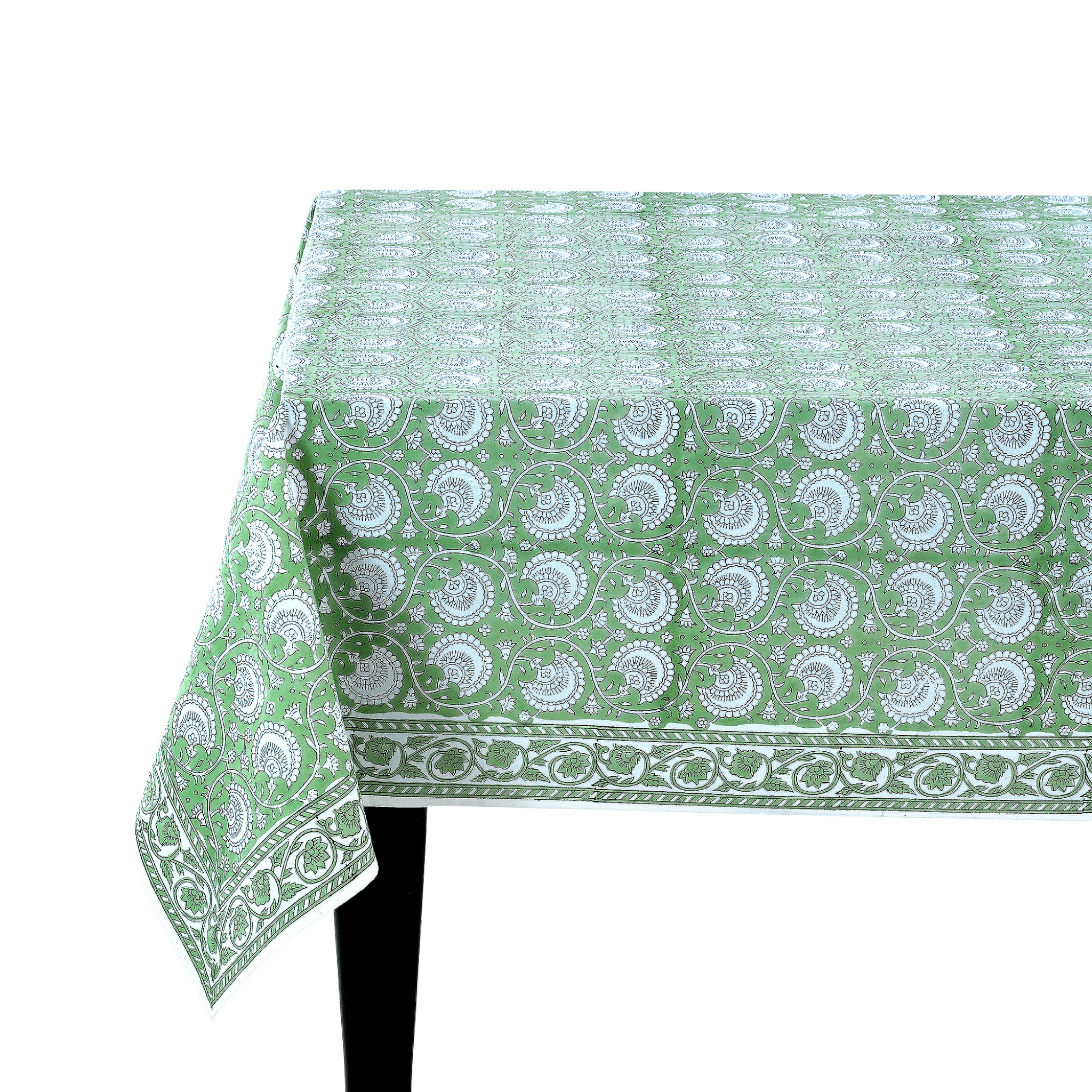 Green and white patterned tablecloth on a white background