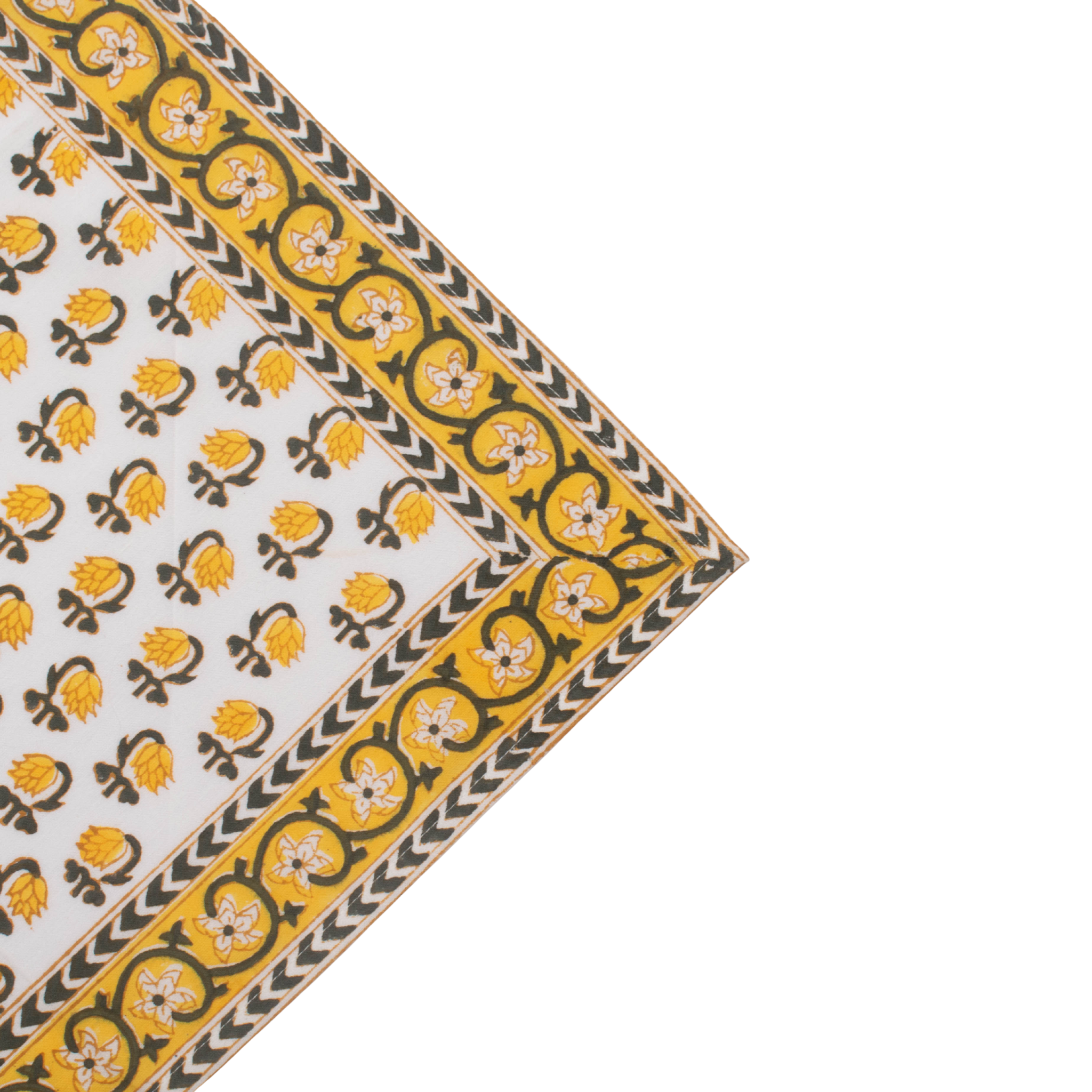 Corner of a fabric with yellow and black pattern on a white background