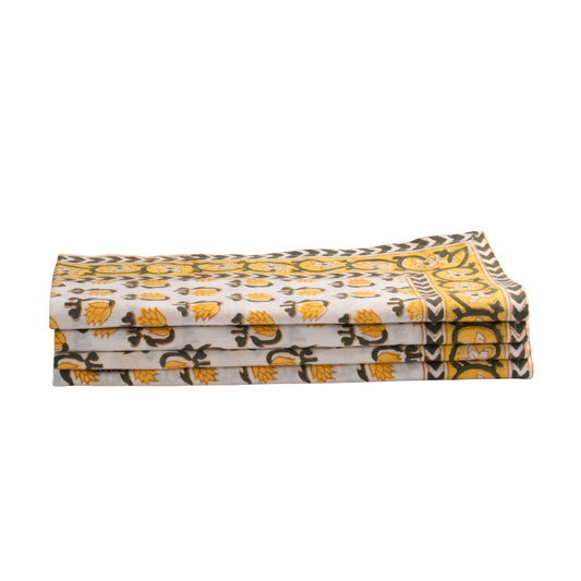 Folded fabric with yellow and black pattern on a white background