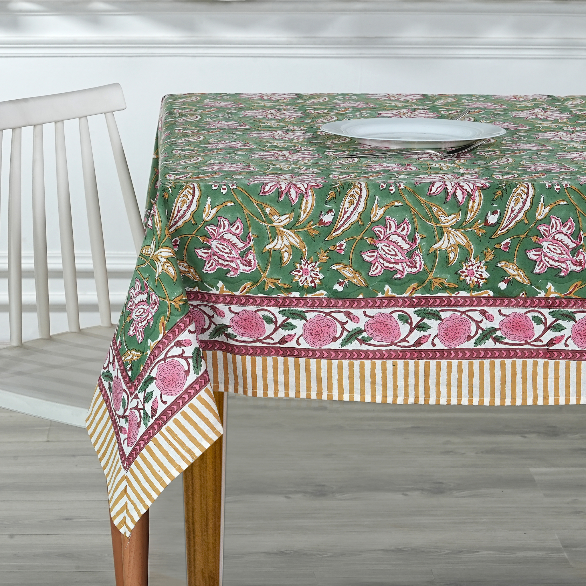 Tablecloth with floral pattern on a wooden table