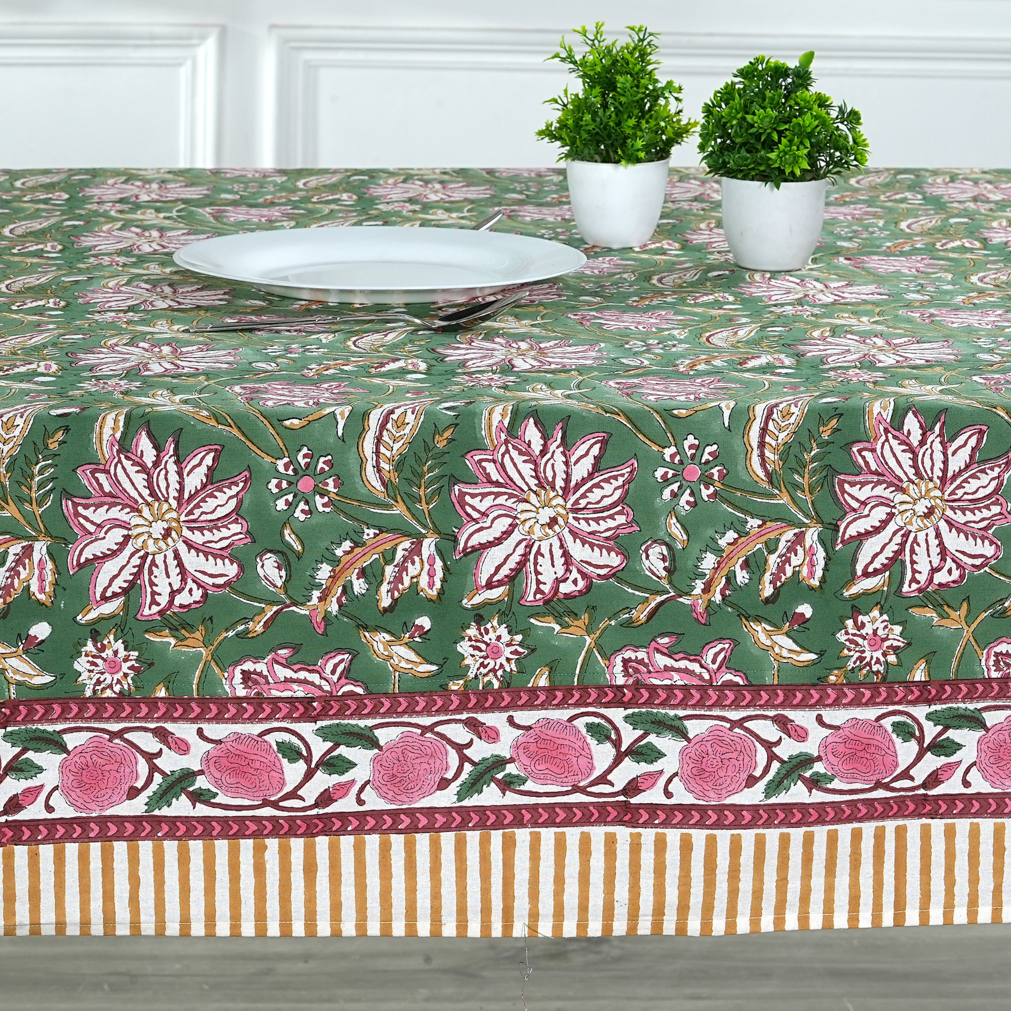 Decorative tablecloth with floral pattern on a table