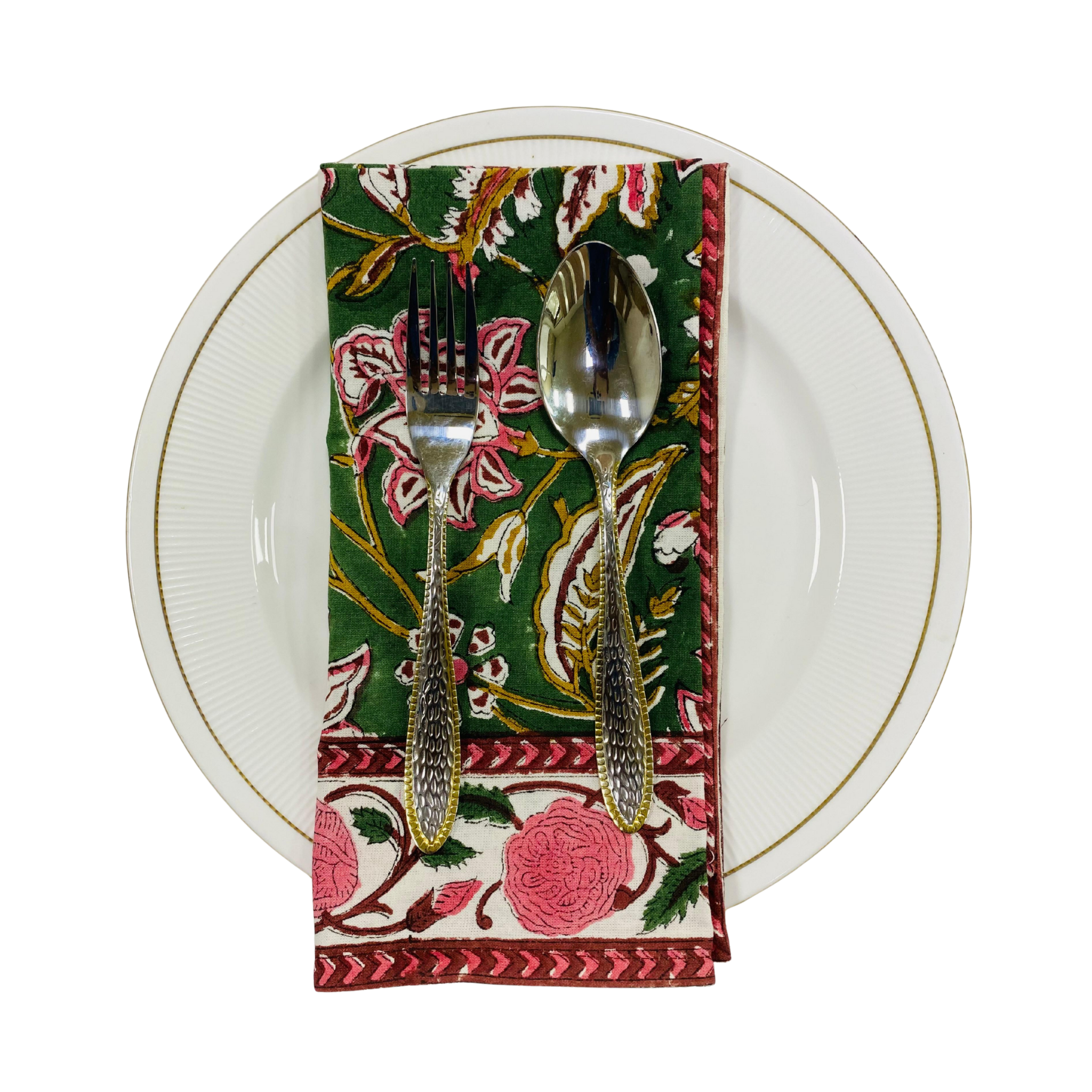 Napkin with floral design holding a fork and spoon on a white plate.