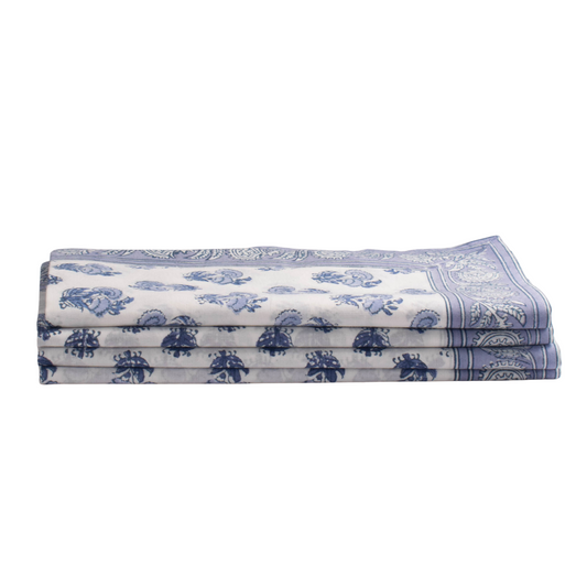 Folded fabric with blue floral patterns on a white background