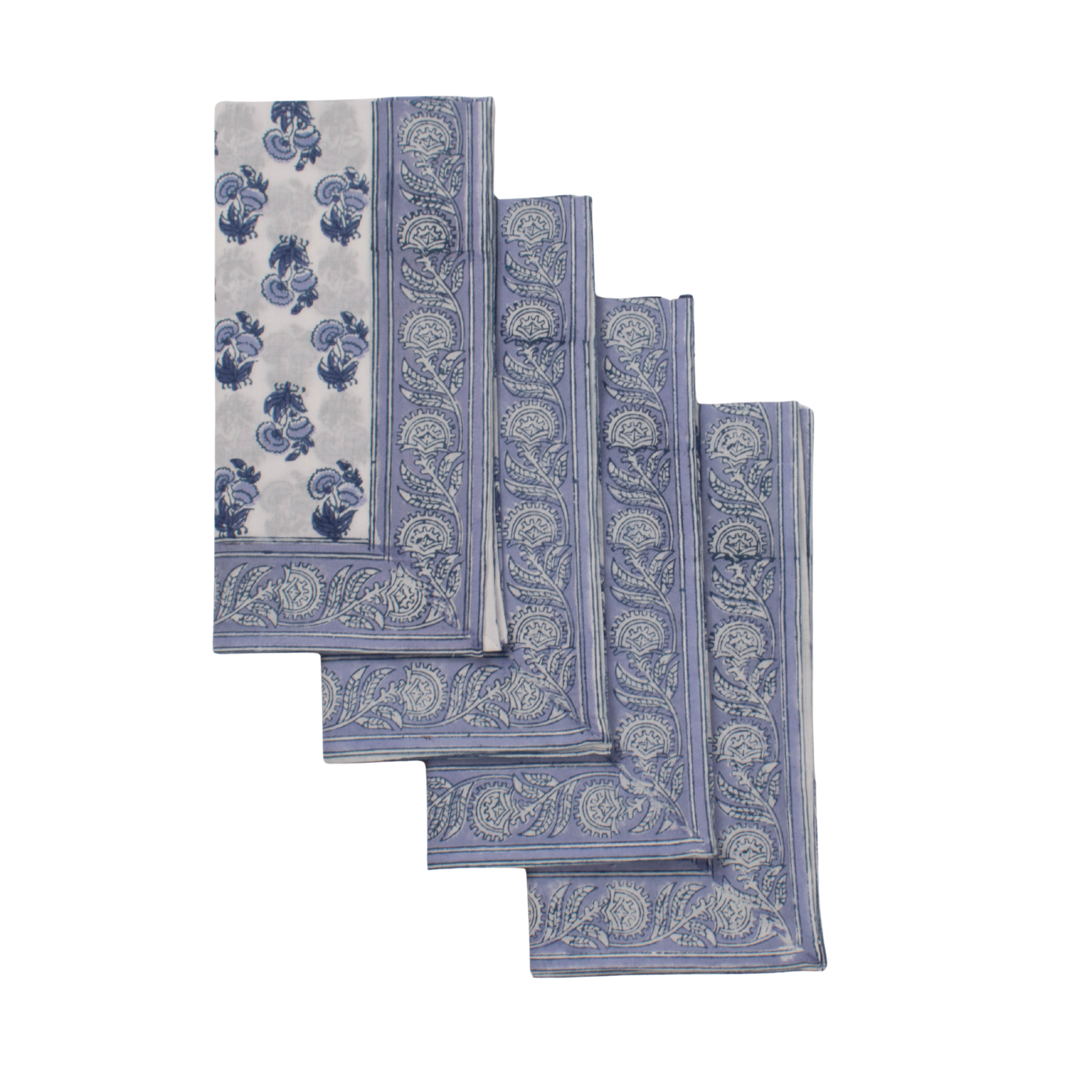 Set of four blue and white patterned napkins on a white background